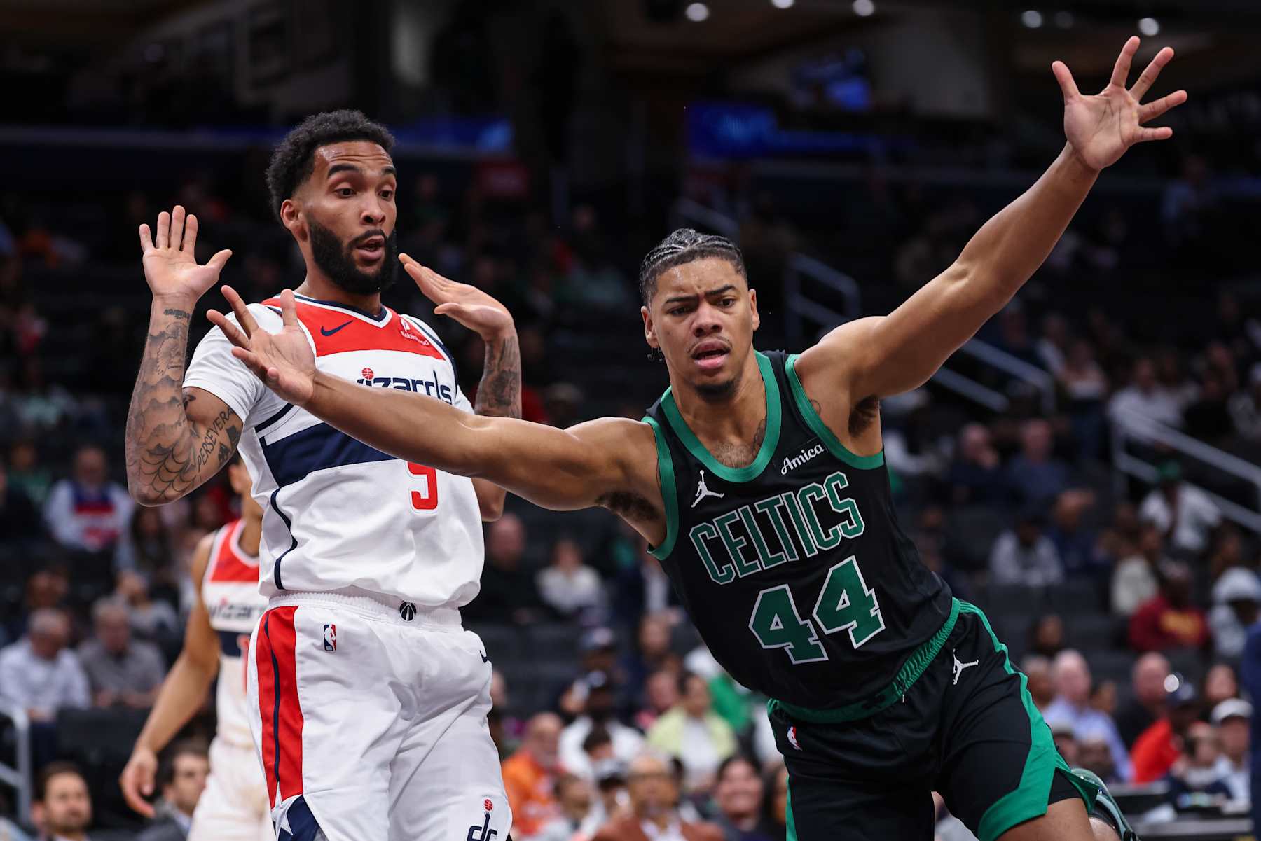 WASHINGTON, DC - OCTOBER 24: Jaden Springer #44 of the Boston Celtics and Justin Champagnie #9 of the Washington Wizards react during the second half at Capital One Arena on October 24, 2024 in Washington, DC. NOTE TO USER: User expressly acknowledges and agrees that, by downloading and or using this photograph, User is consenting to the terms and conditions of the Getty Images License Agreement. (Photo by Scott Taetsch/Getty Images)