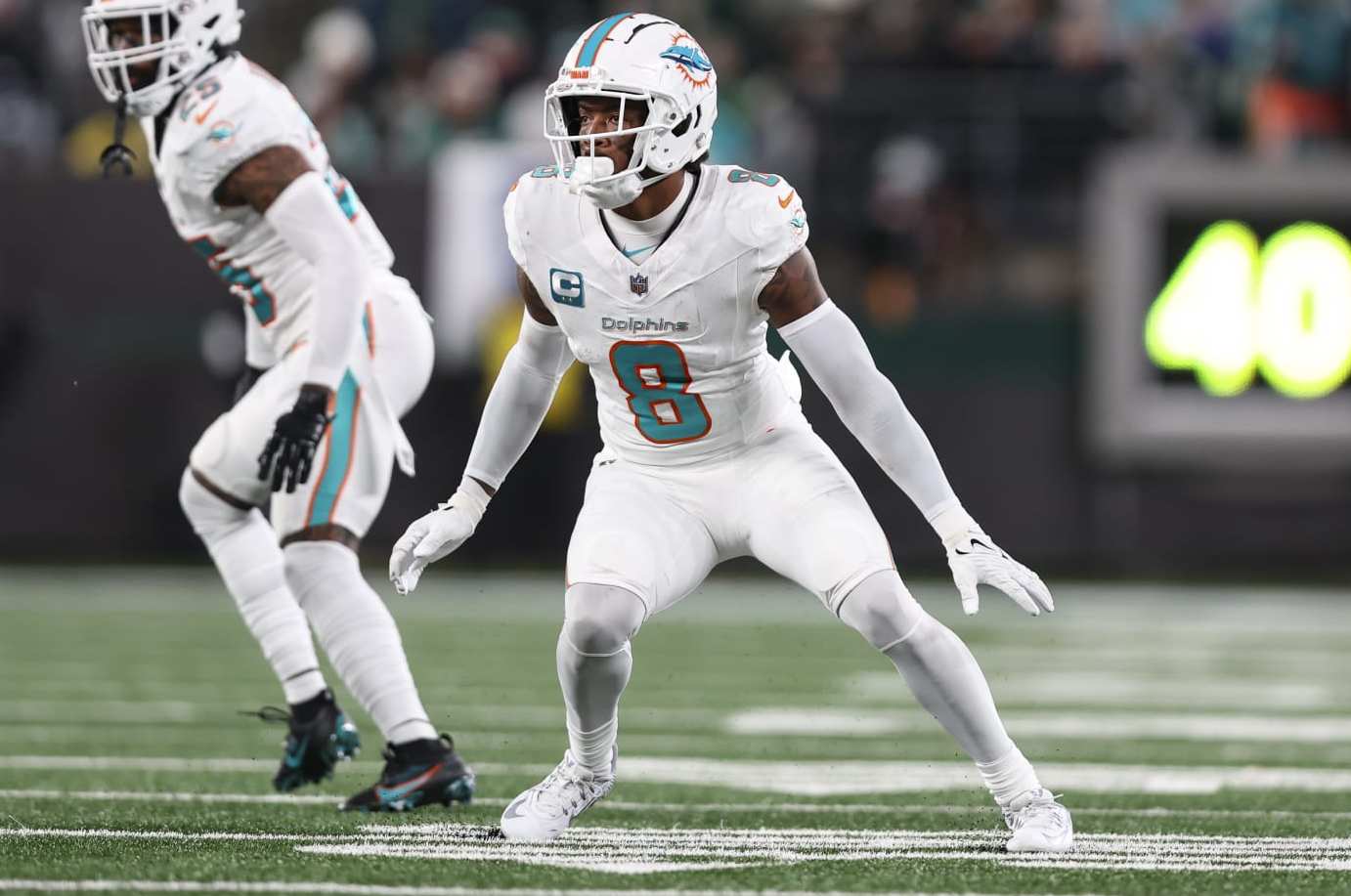 EAST RUTHERFORD, NJ - NOVEMBER 24: Jevon Holland #8 of the Miami Dolphins defends in coverage during an NFL football game against the New York Jets at MetLife Stadium on November 24, 2023 in East Rutherford, New Jersey. (Photo by Perry Knotts/Getty Images)