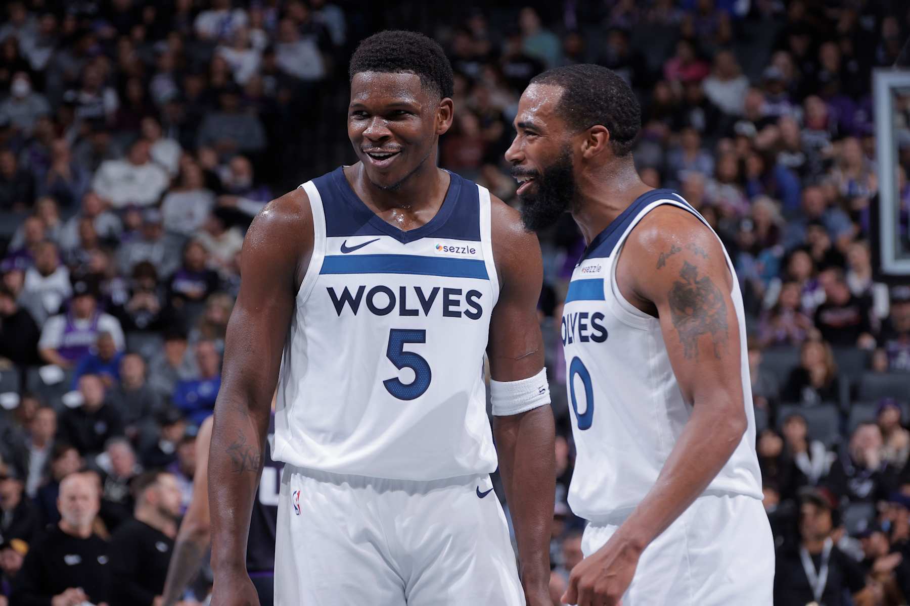SACRAMENTO, CA - NOVEMBER 15: Anthony Edwards #5 and Mike Conley #10 of the Minnesota Timberwolves smile during the game against the Sacramento Kings during the Emirates NBA Cup game on November 15, 2024 at Golden 1 Center in Sacramento, California. NOTE TO USER: User expressly acknowledges and agrees that, by downloading and or using this Photograph, user is consenting to the terms and conditions of the Getty Images License Agreement. Mandatory Copyright Notice: Copyright 2024 NBAE (Photo by Rocky Widner/NBAE via Getty Images)
