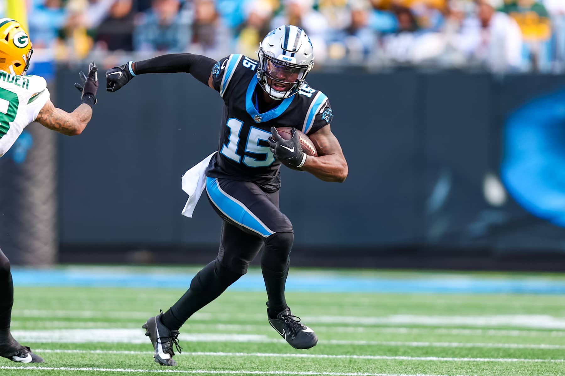 CHARLOTTE, NC - DECEMBER 24: Jonathan Mingo #15 of the Carolina Panthers runs the ball during an NFL game against the Green Bay Packers at Bank of America Stadium on December 24, 2023 in Charlotte, NC. (Photo by David Jensen/Icon Sportswire via Getty Images)