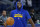 Golden State Warriors forward Draymond Green warms up before an NBA preseason basketball game against the Denver Nuggets in San Francisco, Friday, Oct. 14, 2022. (AP Photo/Jeff Chiu)