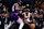 PHOENIX, ARIZONA - NOVEMBER 06: Jimmy Butler #22 of the Miami Heat controls the ball under pressure from Kevin Durant #35 of the Phoenix Suns during the game at Footprint Center on November 06, 2024 in Phoenix, Arizona. The Suns defeated the Heat 115-112. NOTE TO USER: User expressly acknowledges and agrees that, by downloading and or using this photograph, User is consenting to the terms and conditions of the Getty Images License Agreement. (Photo by Chris Coduto/Getty Images)