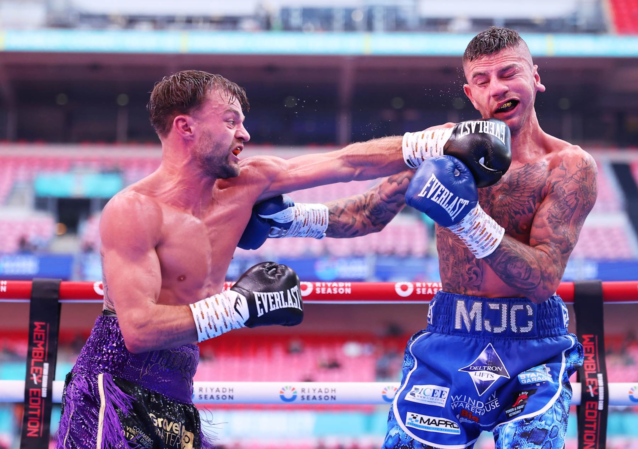 LONDON, ENGLAND - SEPTEMBER 21: Josh Padley punches Mark Chamberlain during the Lightweight fight between Mark Chamberlain and Josh Padley, on the Riyadh Season  - Wembley Edition card at Wembley Stadium on September 21, 2024 in London, England. (Photo by Richard Pelham/Getty Images)