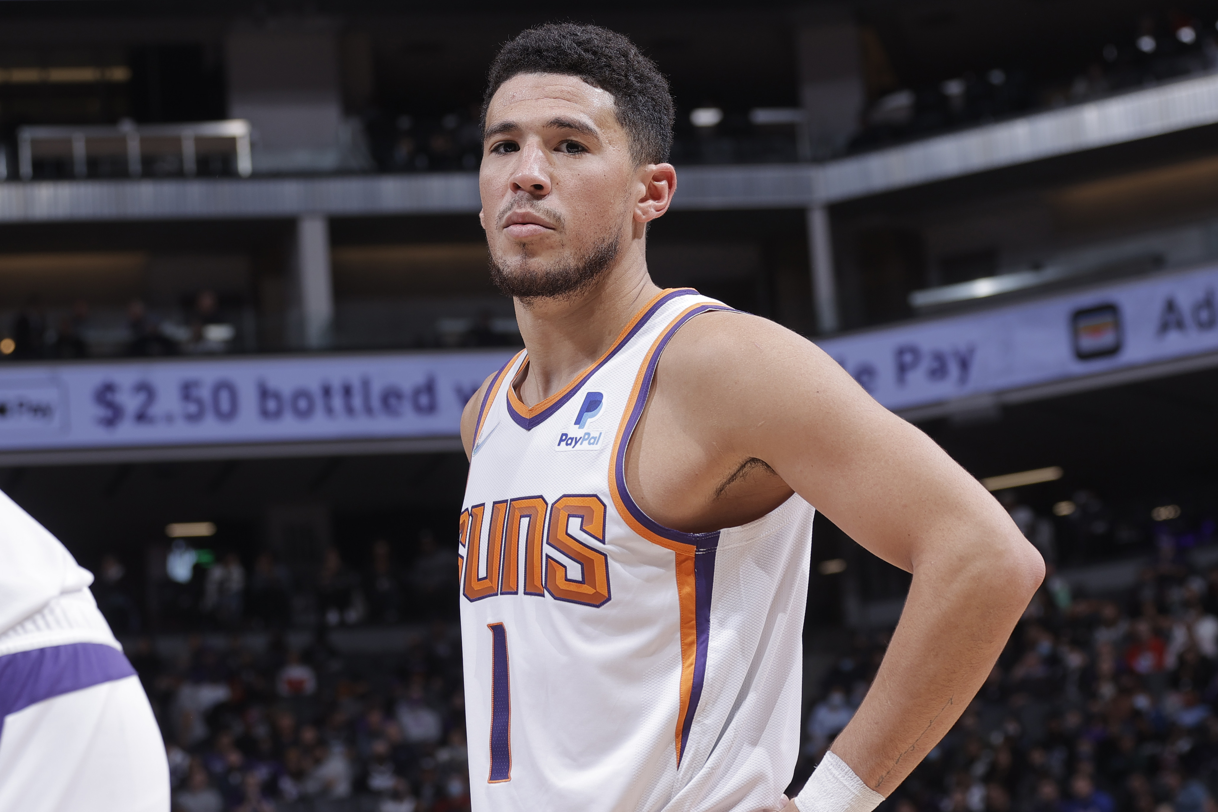 SACRAMENTO, CA - NOVEMBER 8: Devin Booker #1 of the Phoenix Suns looks on during the game against the Sacramento Kings on November 8, 2021 at Golden 1 Center in Sacramento, California. NOTE TO USER: User expressly acknowledges and agrees that, by downloading and or using this Photograph, user is consenting to the terms and conditions of the Getty Images License Agreement. Mandatory Copyright Notice: Copyright 2021 NBAE (Photo by Rocky Widner/NBAE via Getty Images)