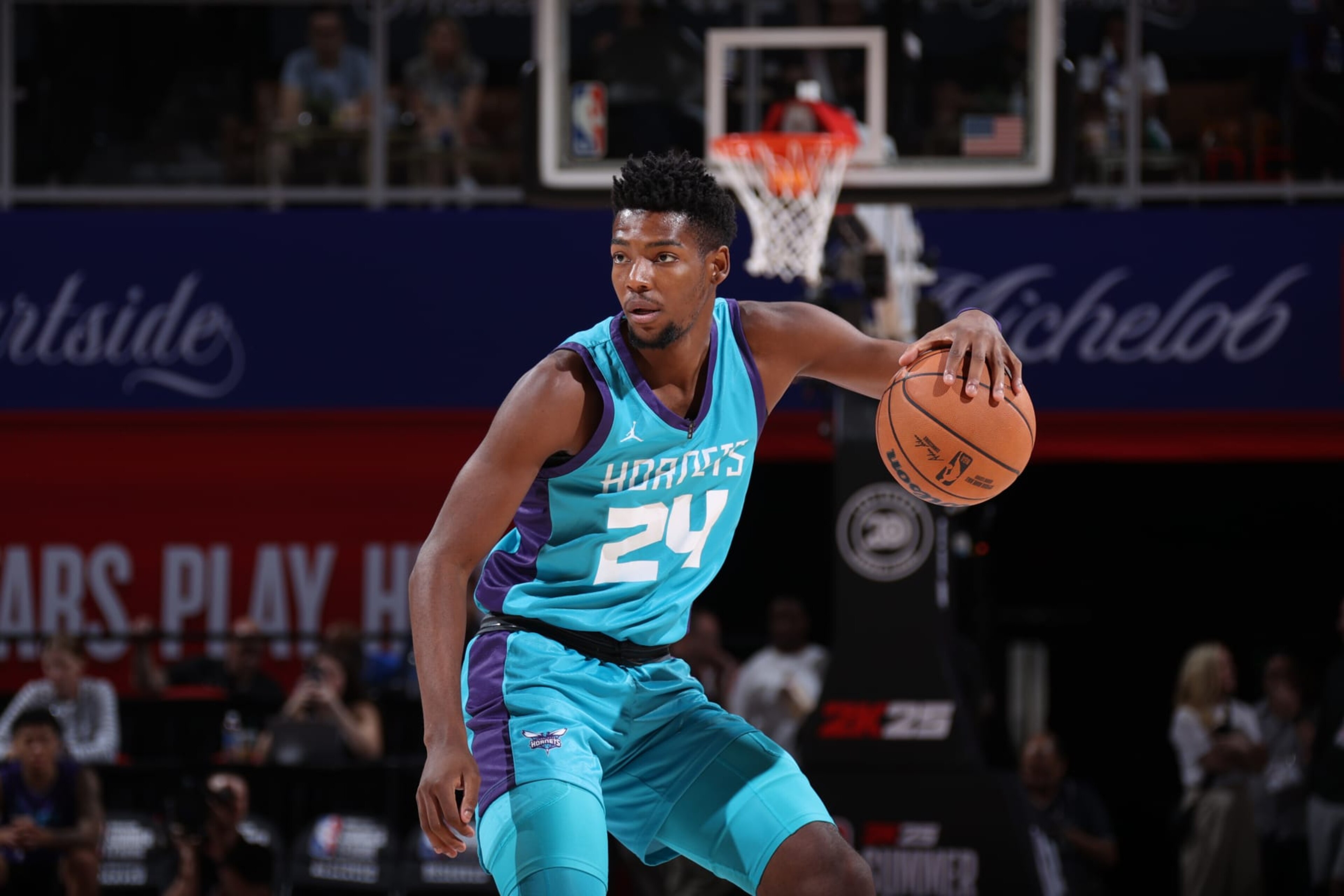 LAS VEGAS, NV - JULY 13:  Brandon Miller #24 of the Charlotte Hornets handles the ball during the game against the New York Knicks on July 13, 2024 at the Thomas & Mack Center in Las Vegas, Nevada. NOTE TO USER: User expressly acknowledges and agrees that, by downloading and or using this photograph, User is consenting to the terms and conditions of the Getty Images License Agreement. Mandatory Copyright Notice: Copyright 2024 NBAE (Photo by Stephen Gosling/NBAE via Getty Images)