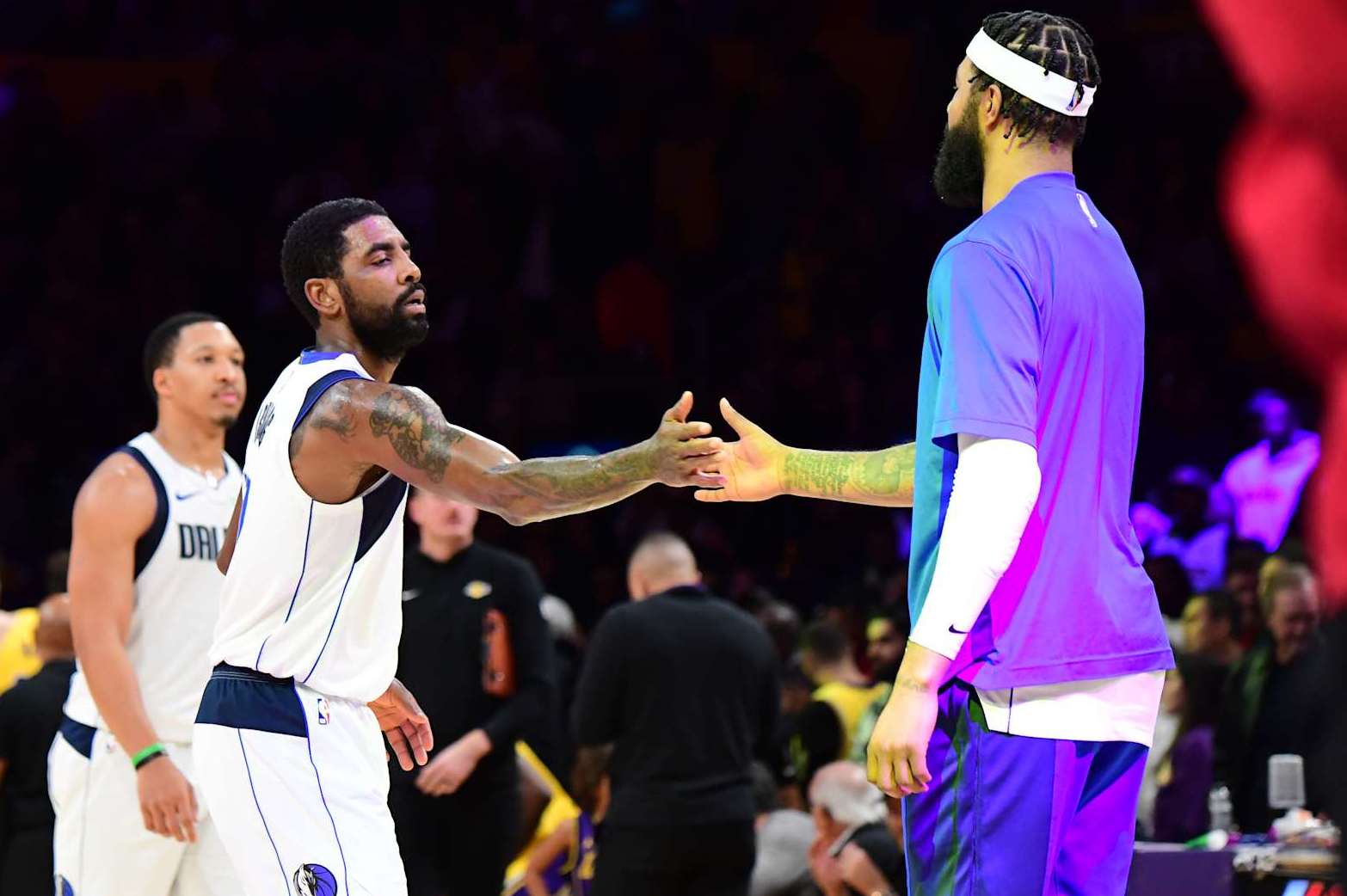 LOS ANGELES, CA - NOVEMBER 22: Kyrie Irving #11 of the Dallas Mavericks high fives Anthony Davis #3 of the Los Angeles Lakers during the game on November 22, 2023 at Crypto.Com Arena in Los Angeles, California. NOTE TO USER: User expressly acknowledges and agrees that, by downloading and/or using this Photograph, user is consenting to the terms and conditions of the Getty Images License Agreement. Mandatory Copyright Notice: Copyright 2023 NBAE (Photo by Adam Pantozzi/NBAE via Getty Images)