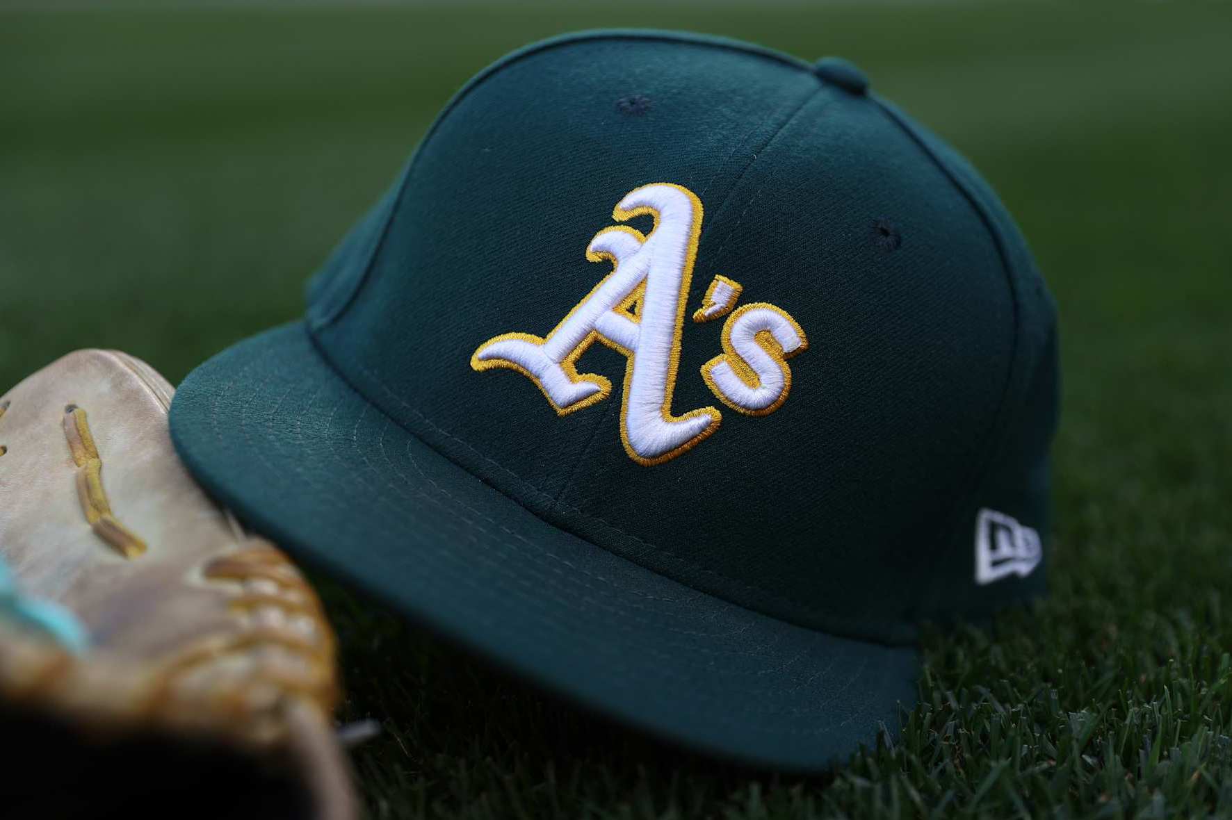 SEATTLE, WASHINGTON - SEPTEMBER 27: A general view of an Oakland Athletics logo and hat before the game against the Seattle Mariners at T-Mobile Park on September 27, 2024 in Seattle, Washington. (Photo by Steph Chambers/Getty Images)