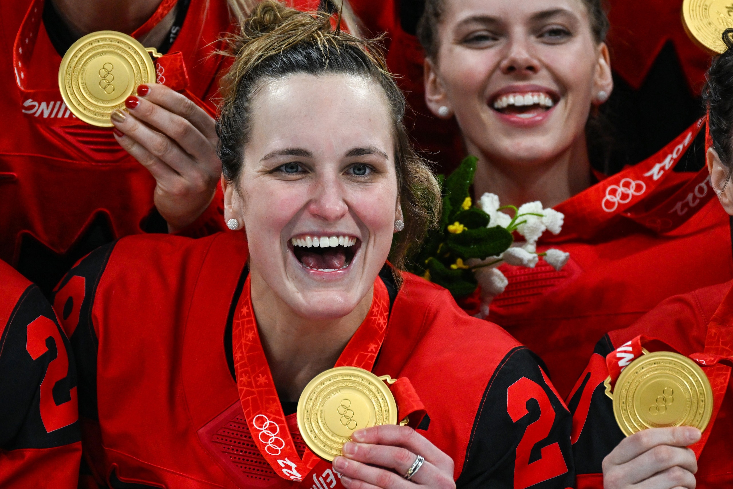 Canada's Marie-Philip Poulin celebrates during the victory ceremony of the women's ice hockey competition during the Beijing 2022 Winter Olympic Games at the Wukesong Sports Centre in Beijing on February 17, 2022. (Photo by GABRIEL BOUYS / AFP) (Photo by GABRIEL BOUYS/AFP via Getty Images)
