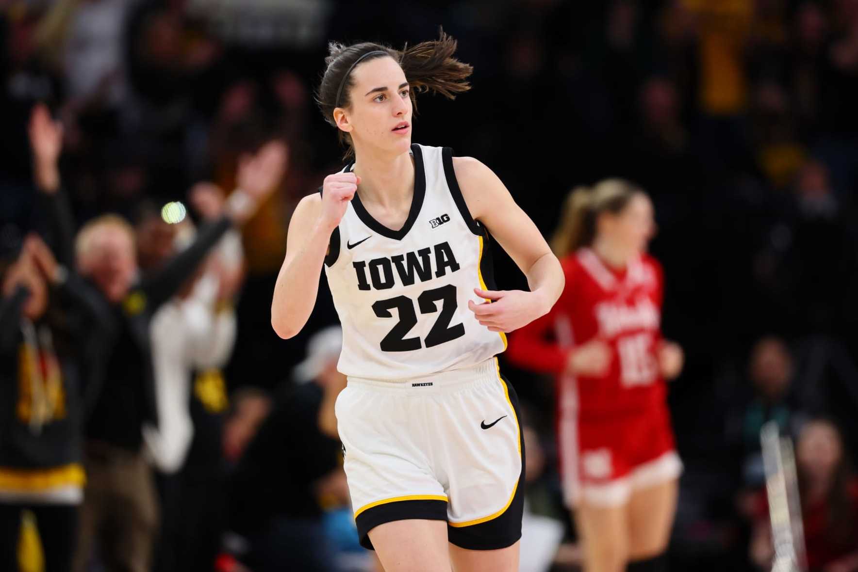 MINNEAPOLIS, MINNESOTA - MARCH 10: Caitlin Clark #22 of the Iowa Hawkeyes reacts after a three point basket in the first half against the Nebraska Cornhuskers during the Big Ten Women's Basketball Tournament Championship at Target Center on March 10, 2024 in Minneapolis, Minnesota. (Photo by Adam Bettcher/Getty Images)