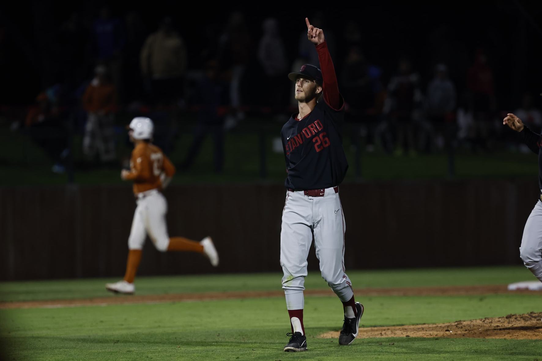 Stanford pitcher Quinn Mathews (26) celebrates against Texas in the ninth inning of an NCAA college baseball tournament super regional game in Stanford, Calif., Sunday, June 11, 2023. (AP Photo/Josie Lepe)