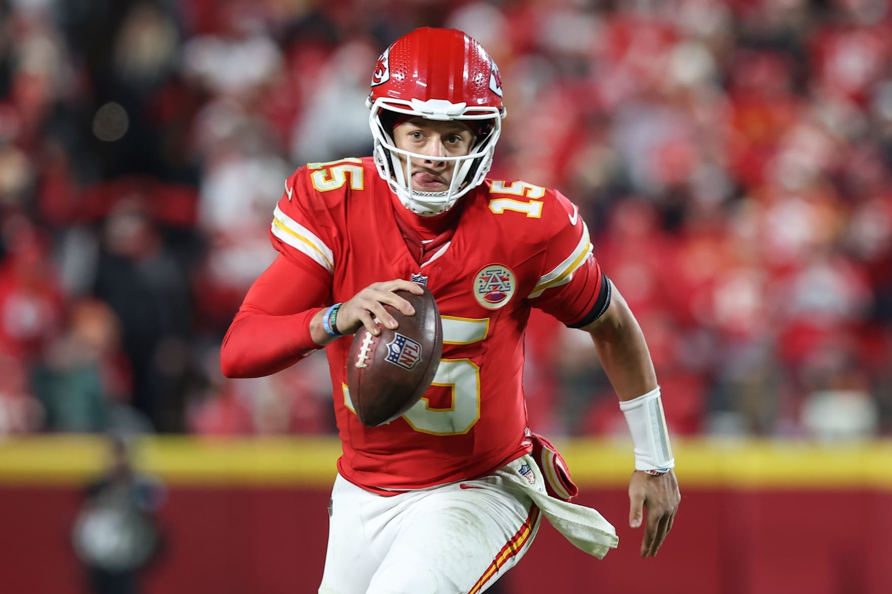 KANSAS CITY, MO - DECEMBER 08: Kansas City Chiefs quarterback Patrick Mahomes (15) scrambles for 10 yards and a first down late in the fourth quarter of an NFL game between the Los Angeles Chargers and Kansas City Chiefs on December 8, 2024 at GEHA Field at Arrowhead Stadium in Kansas City, MO. (Photo by Scott Winters/Icon Sportswire via Getty Images)