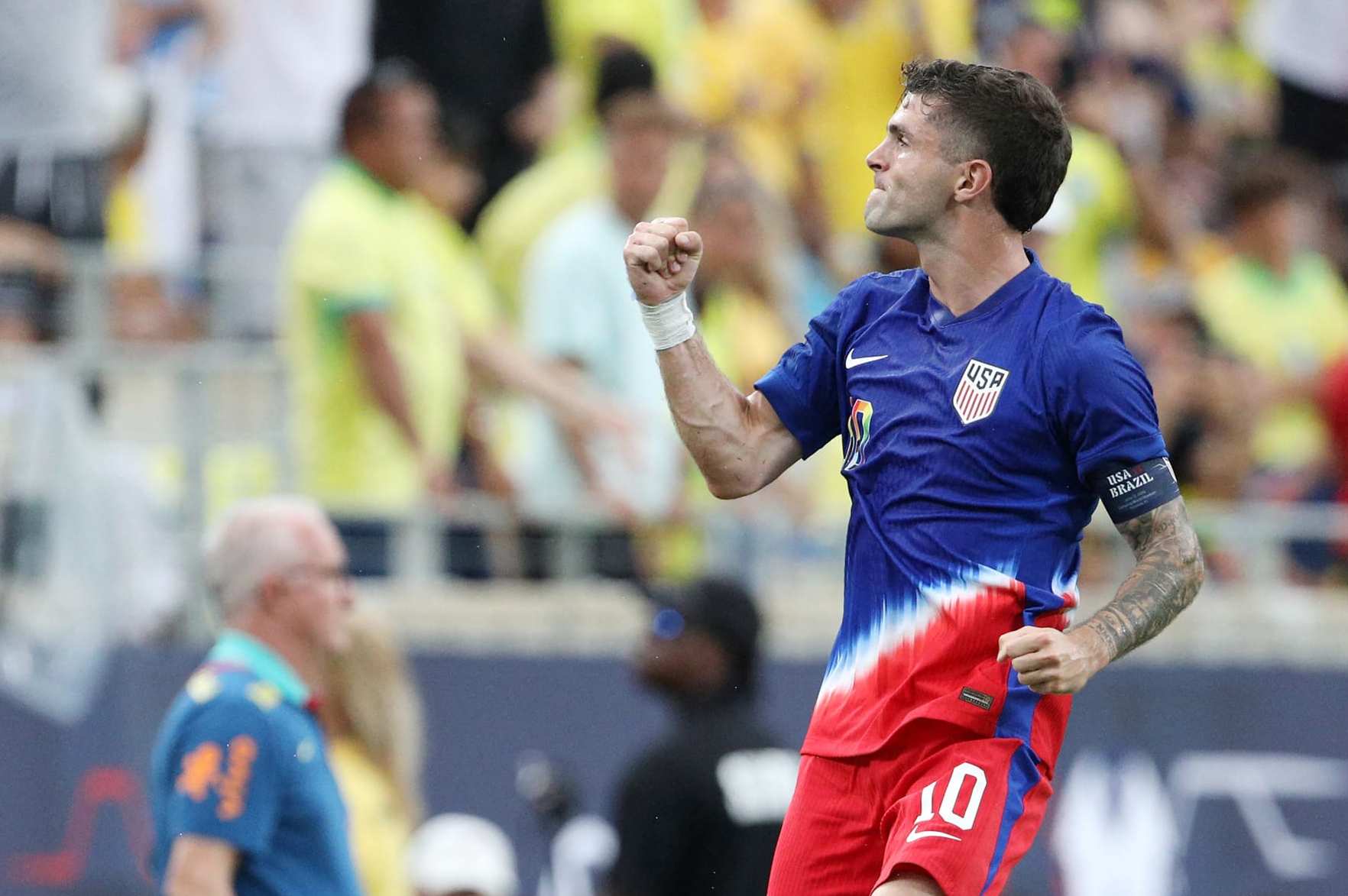 USA's forward #10 Christian Pulisic celebrates scoring his team's first goal during the Continental Clasico 2024 international friendly football match between USA and Brazil at the Camping World Stadium in Orlando, Florida, June 12, 2024. (Photo by Gregg Newton / AFP) (Photo by GREGG NEWTON/AFP via Getty Images)