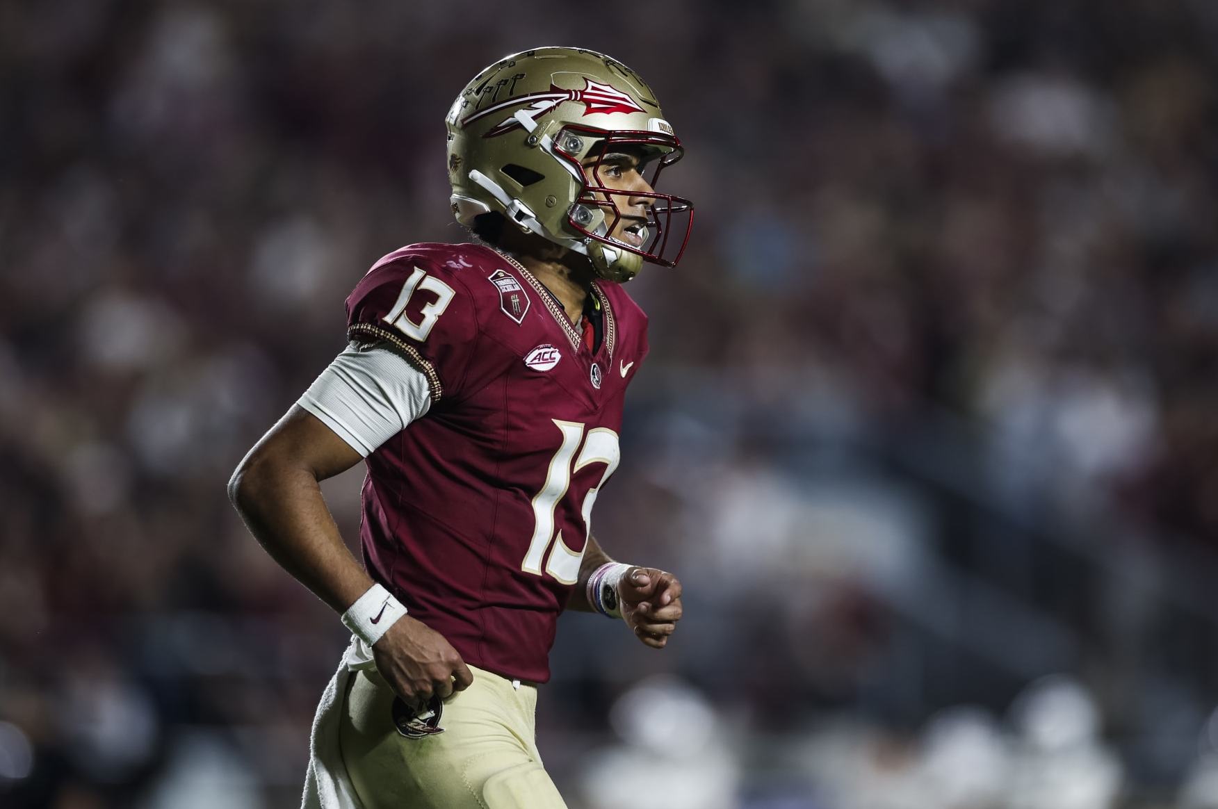 TALLAHASSEE, FLORIDA - NOVEMBER 11: Jordan Travis #13 of the Florida State Seminoles looks on during the second half of a game against the Miami Hurricanes at Doak Campbell Stadium on November 11, 2023 in Tallahassee, Florida. (Photo by James Gilbert/Getty Images)