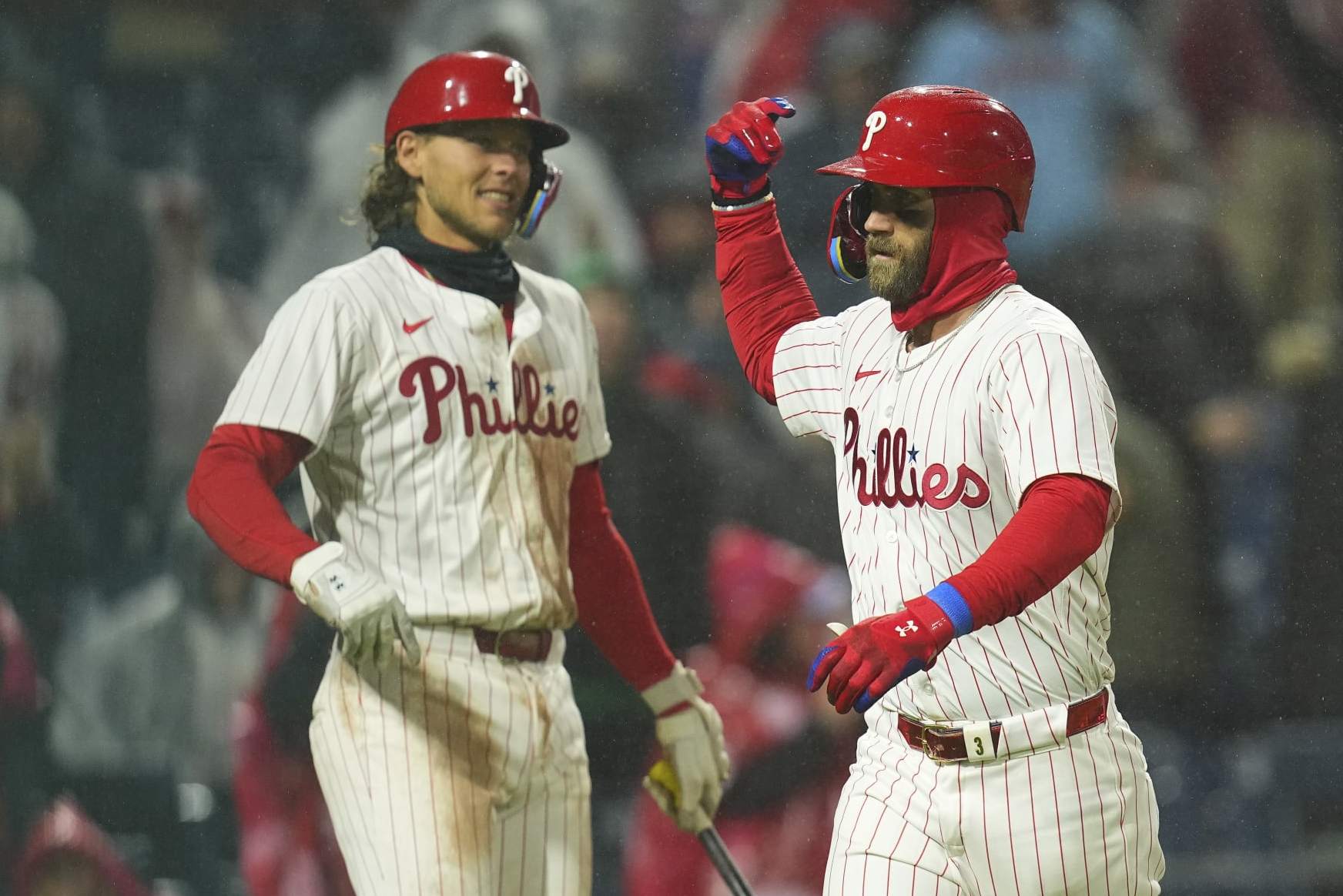 PHILADELPHIA, PENNSYLVANIA - APRIL 2: Bryce Harper #3 of the Philadelphia Phillies celebrates with Alec Bohm #28 after hitting a solo home run in the bottom of the fourth inning against the Cincinnati Reds at Citizens Bank Park on April 2, 2024 in Philadelphia, Pennsylvania. The Phillies defeated the Reds 9-4. (Photo by Mitchell Leff/Getty Images)