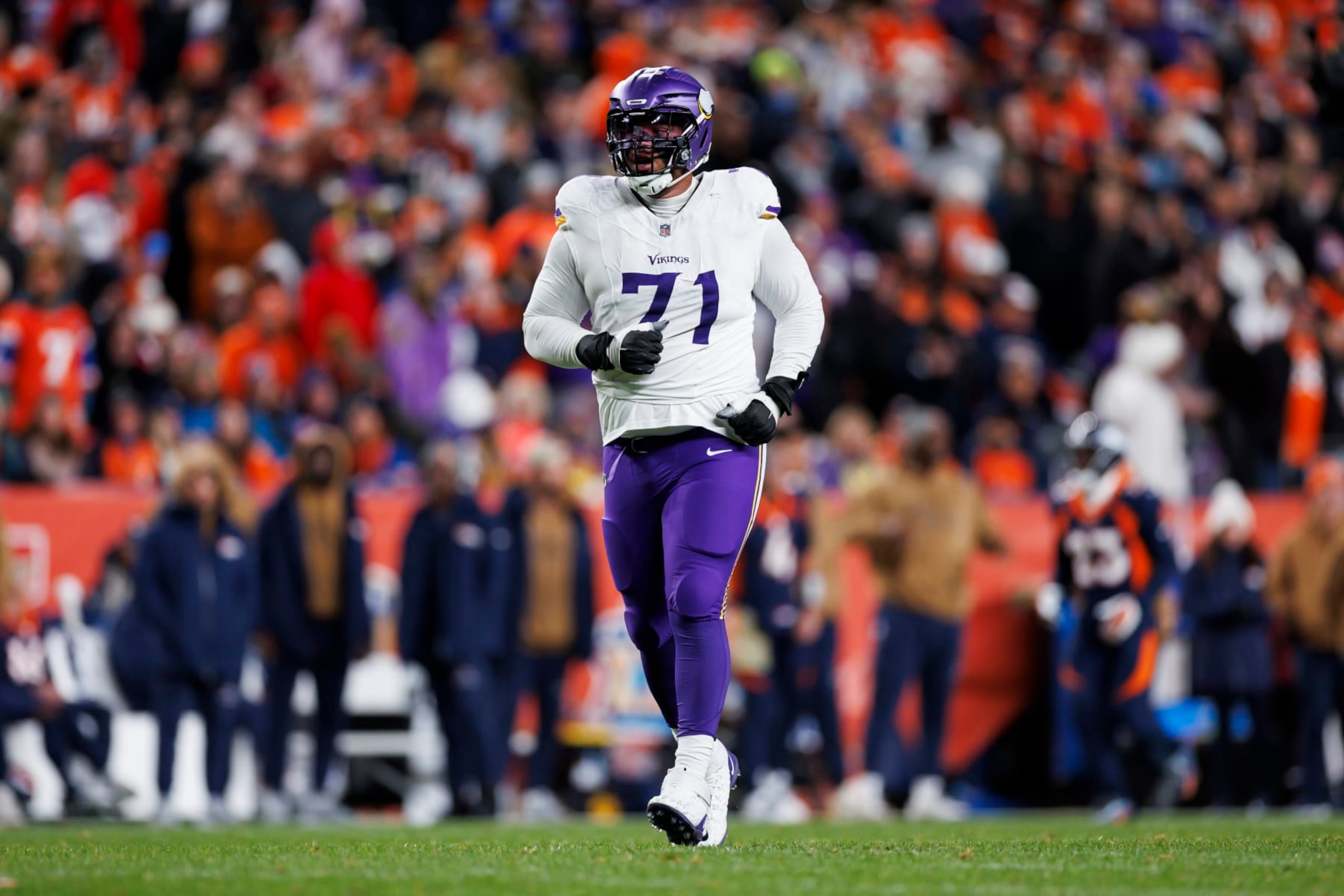 DENVER, COLORADO - NOVEMBER 19: Christian Darrisaw #71 of the Minnesota Vikings runs during an NFL football game against the Denver Broncos at Empower Field at Mile High on November 19, 2023 in Denver, Colorado. (Photo by Ryan Kang/Getty Images)