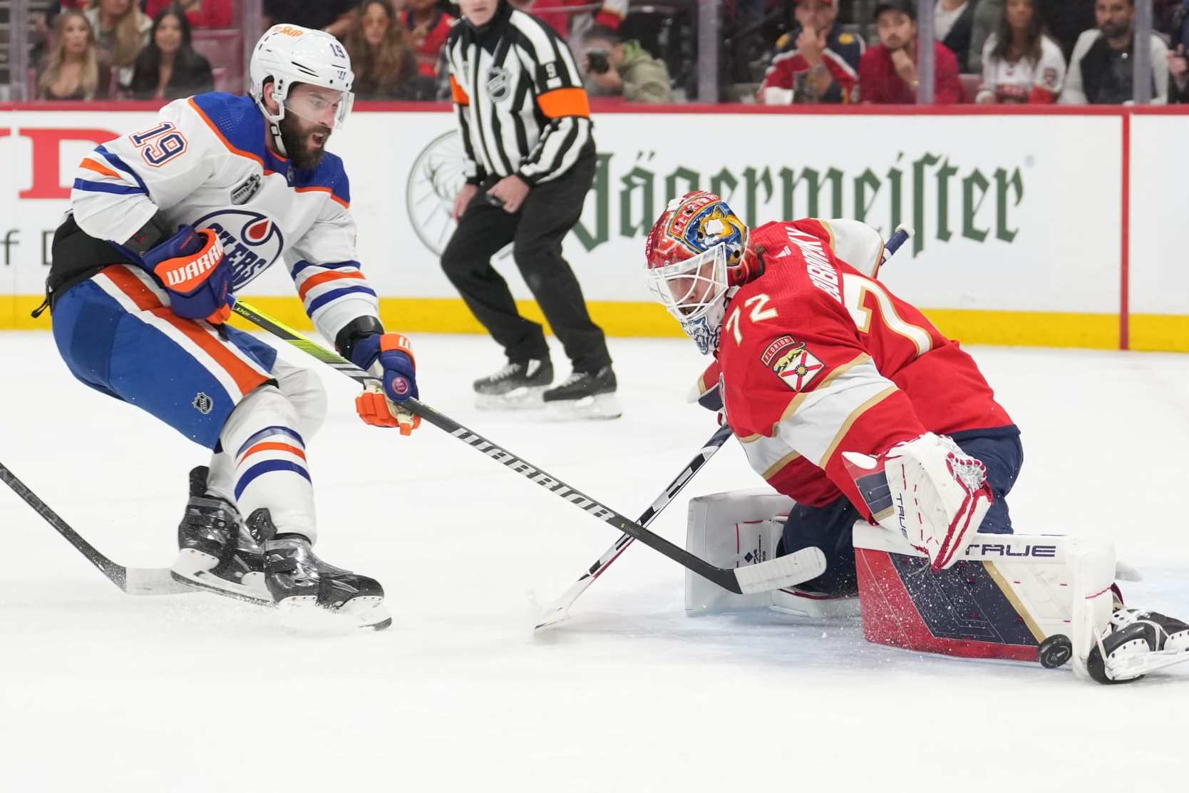 SUNRISE, FL - JUNE 08: Florida Panthers goaltender Sergei Bobrovsky (72) beats an attempt by Edmonton Oilers center Adam Henrique (19) in the first period during game one of the Stanley Cup Finals between the Edmonton Oilers and the Florida Panthers on Saturday, June 8, 2024 at Amerant Bank Area in Sunrise, Fla. (Photo by Peter Joneleit/Icon Sportswire via Getty Images)