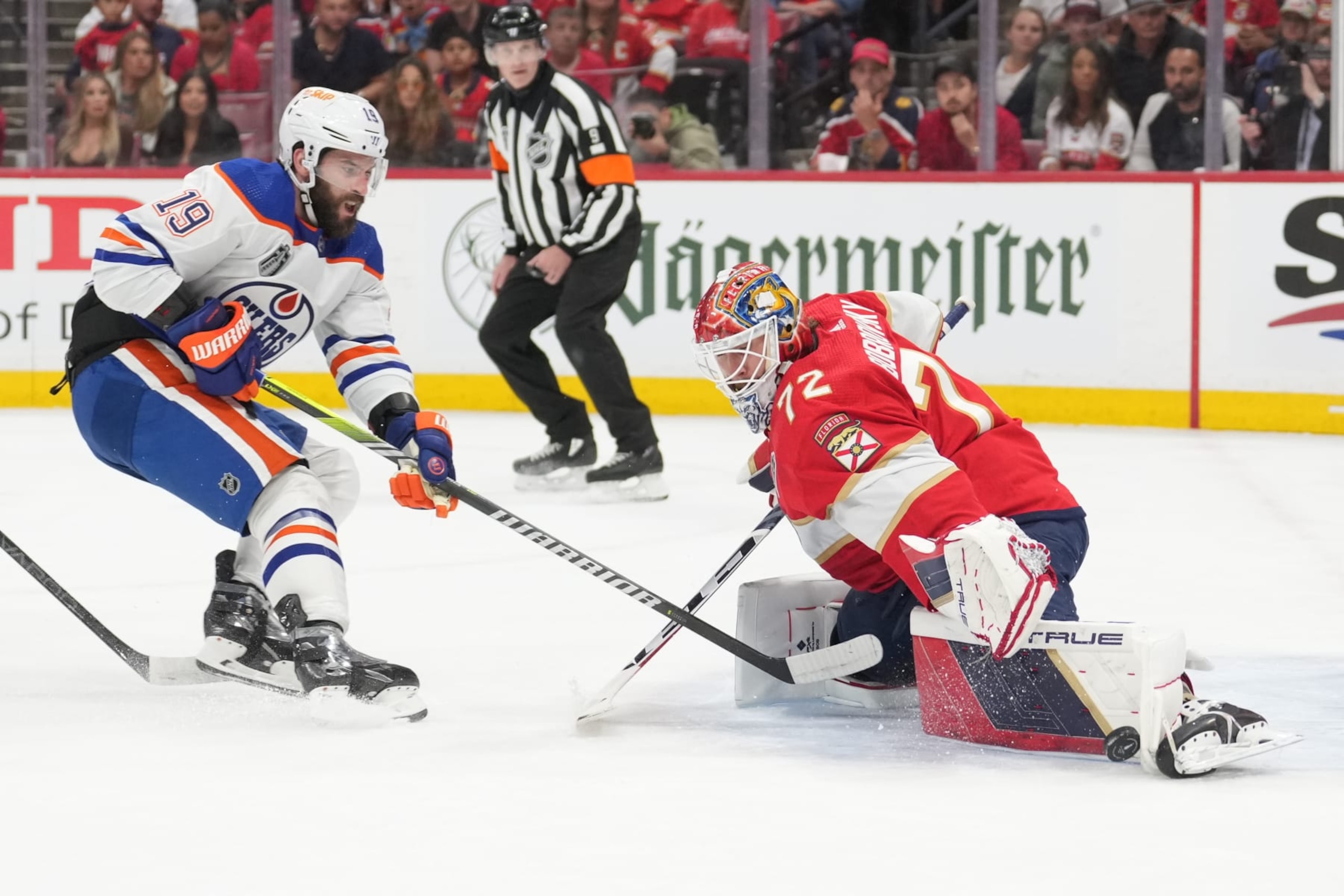 SUNRISE, FL - JUNE 08: Florida Panthers goaltender Sergei Bobrovsky (72) beats an attempt by Edmonton Oilers center Adam Henrique (19) in the first period during game one of the Stanley Cup Finals between the Edmonton Oilers and the Florida Panthers on Saturday, June 8, 2024 at Amerant Bank Area in Sunrise, Fla. (Photo by Peter Joneleit/Icon Sportswire via Getty Images)