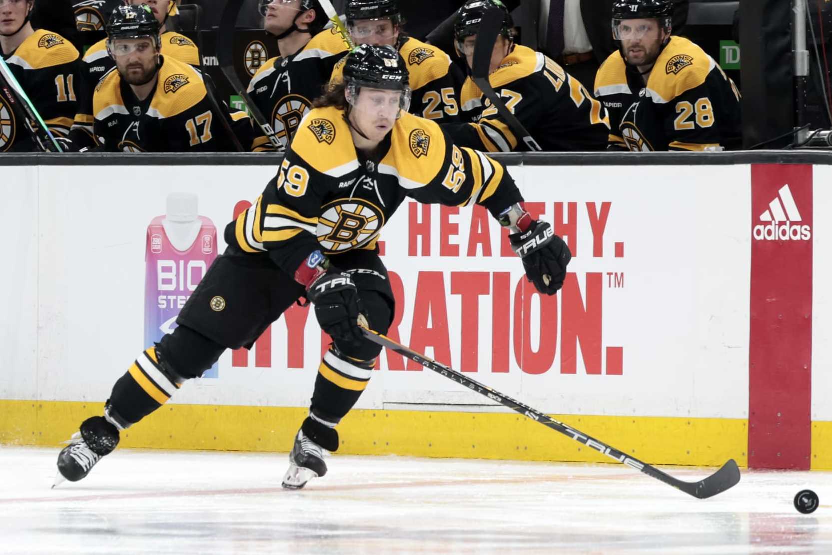 BOSTON, MA - APRIL 17: Boston Bruins right wing Tyler Bertuzzi (59) picks up the puck during Game 1 of an Eastern Conference First Round playoff contest between the Boston Bruins and the Florida Panthers on April 17, 2023, at TD Garden in Boston, Massachusetts. (Photo by Fred Kfoury III/Icon Sportswire via Getty Images)