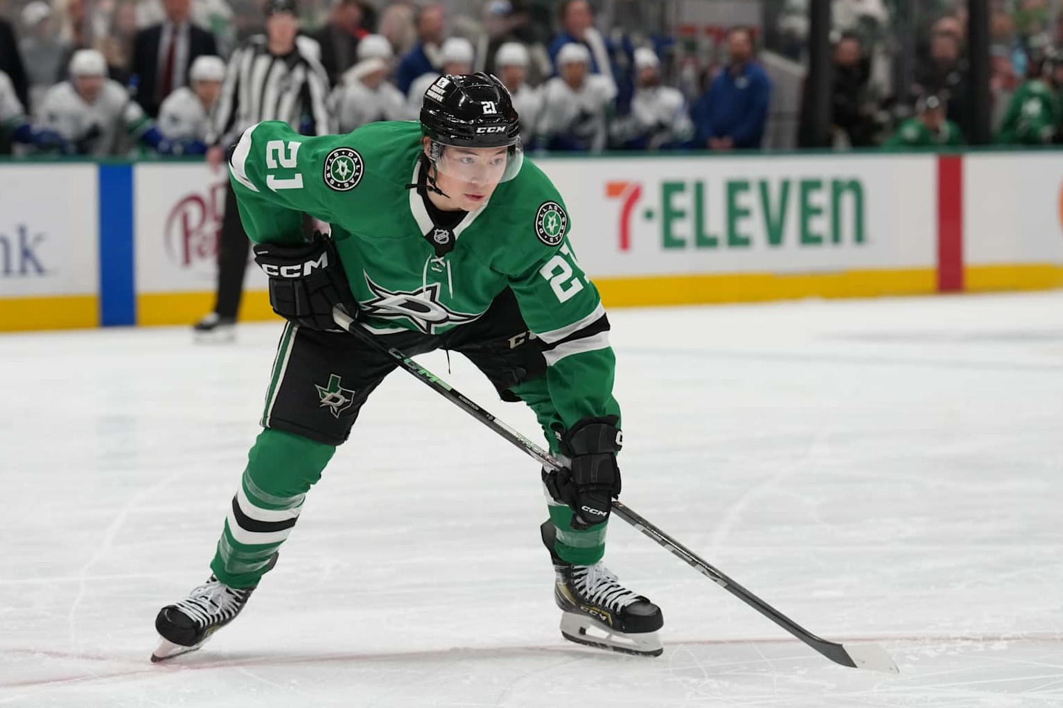 DALLAS, TX - JANUARY 31: Jason Robertson #21 of the Dallas Stars lines up against the Vancouver Canucks at the American Airlines Center on January 31, 2025 in Dallas, Texas. (Photo by Glenn James/NHLI via Getty Images)