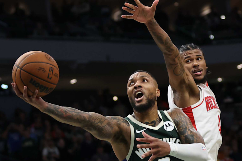 MILWAUKEE, WISCONSIN - NOVEMBER 18: Damian Lillard #0 of the Milwaukee Bucks drives to the basket against Jalen Green #4 of the Houston Rockets during the second half of a game at Fiserv Forum on November 18, 2024 in Milwaukee, Wisconsin. NOTE TO USER: User expressly acknowledges and agrees that, by downloading and or using this photograph, User is consenting to the terms and conditions of the Getty Images License Agreement. (Photo by Stacy Revere/Getty Images)