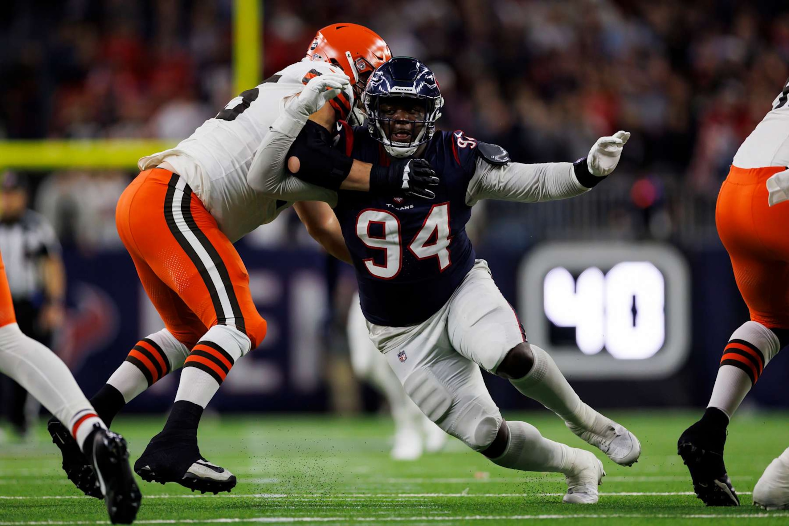 HOUSTON, TEXAS - JANUARY 13: Khalil Davis #94 of the Houston Texans rushes the line of scrimmage during an AFC wild-card playoff football game against the Cleveland Browns at NRG Stadium on January 13, 2024 in Houston, Texas. (Photo by Ryan Kang/Getty Images) HOUSTON, TEXAS - JANUARY 13: Khalil Davis #94 of the Houston Texans rushes the line of scrimmage during an AFC wild-card playoff football game against the Cleveland Browns at NRG Stadium on January 13, 2024 in Houston, Texas. (Photo by Ryan Kang/Getty Images)