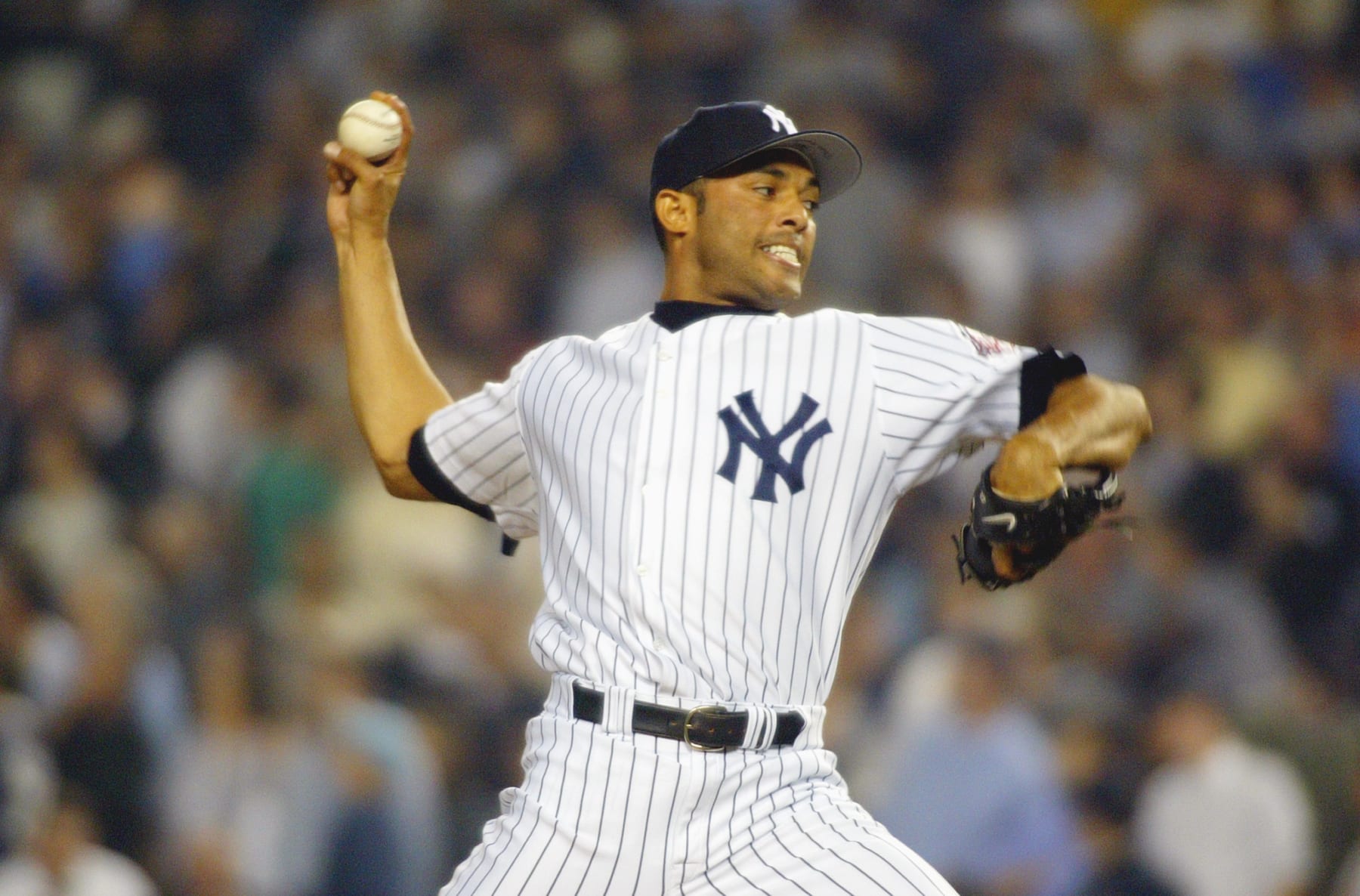 BRONX, NY - OCTOBER 9:  Pitcher Mariano Rivera #42 of the New York Yankees delivers against the Boston Red Sox during game 2 of the American League Championship Series at Yankee Stadium on October 9, 2003 in the Bronx, New York.  The Yankees defeated the Red Sox 6-2.  (Photo by Al Bello/Getty Images)