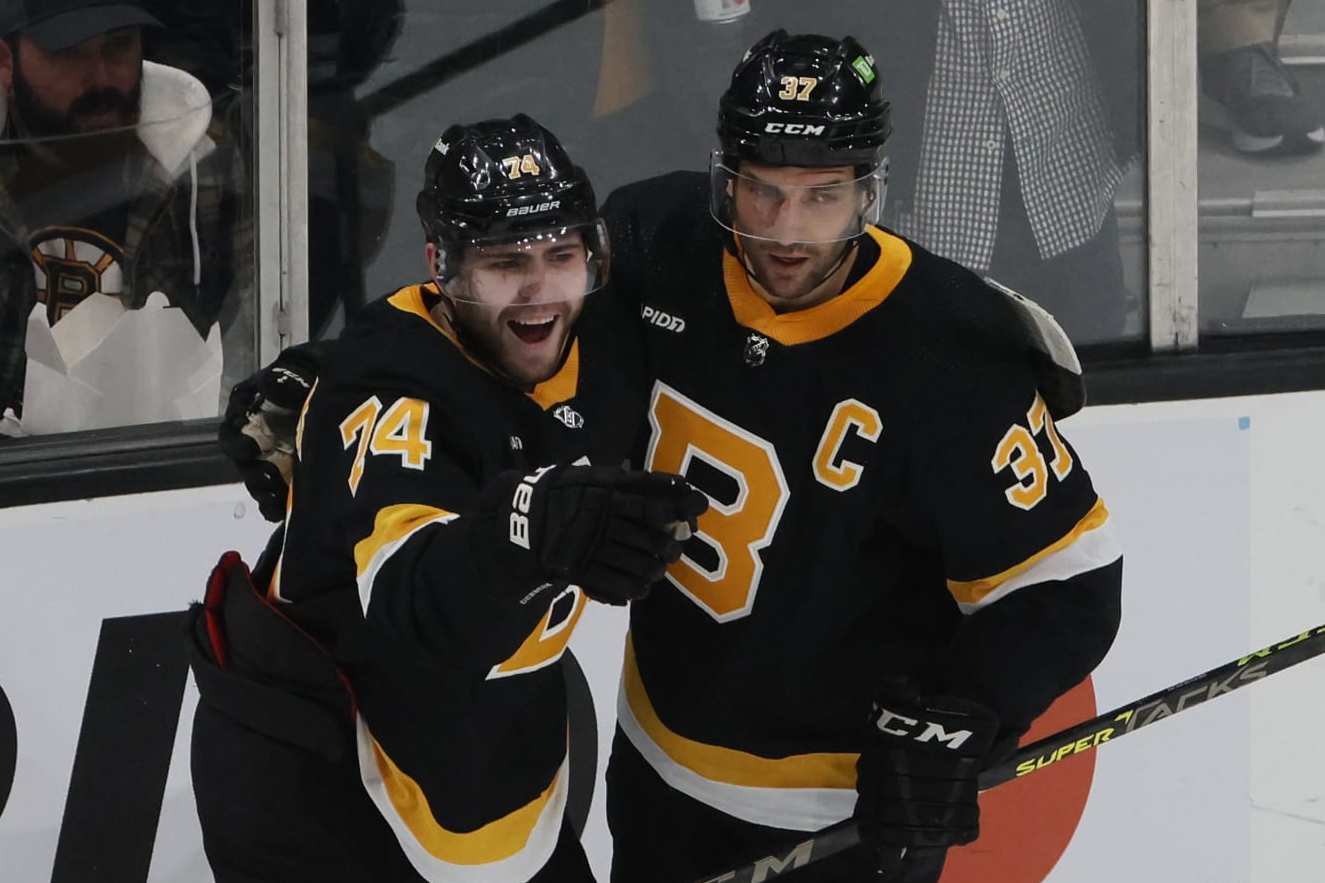 Boston, MA - February 20: Boston Bruins LW Jake DeBrusk points and smiles after scoring a goal in the first period. The Bruins beat the Ottawa Senators, 3-1. (Photo by Jessica Rinaldi/The Boston Globe via Getty Images)