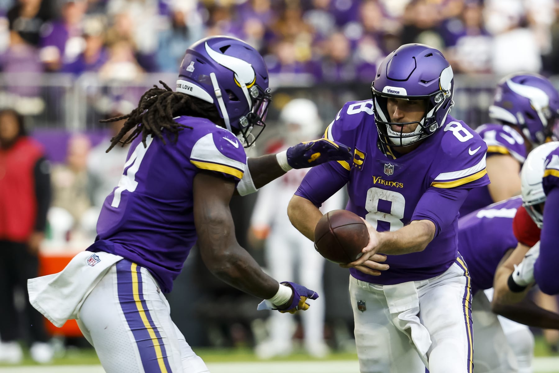 Former Minnesota Vikings running back Dalvin Cook (left) and quarterback Kirk Cousins (right)
