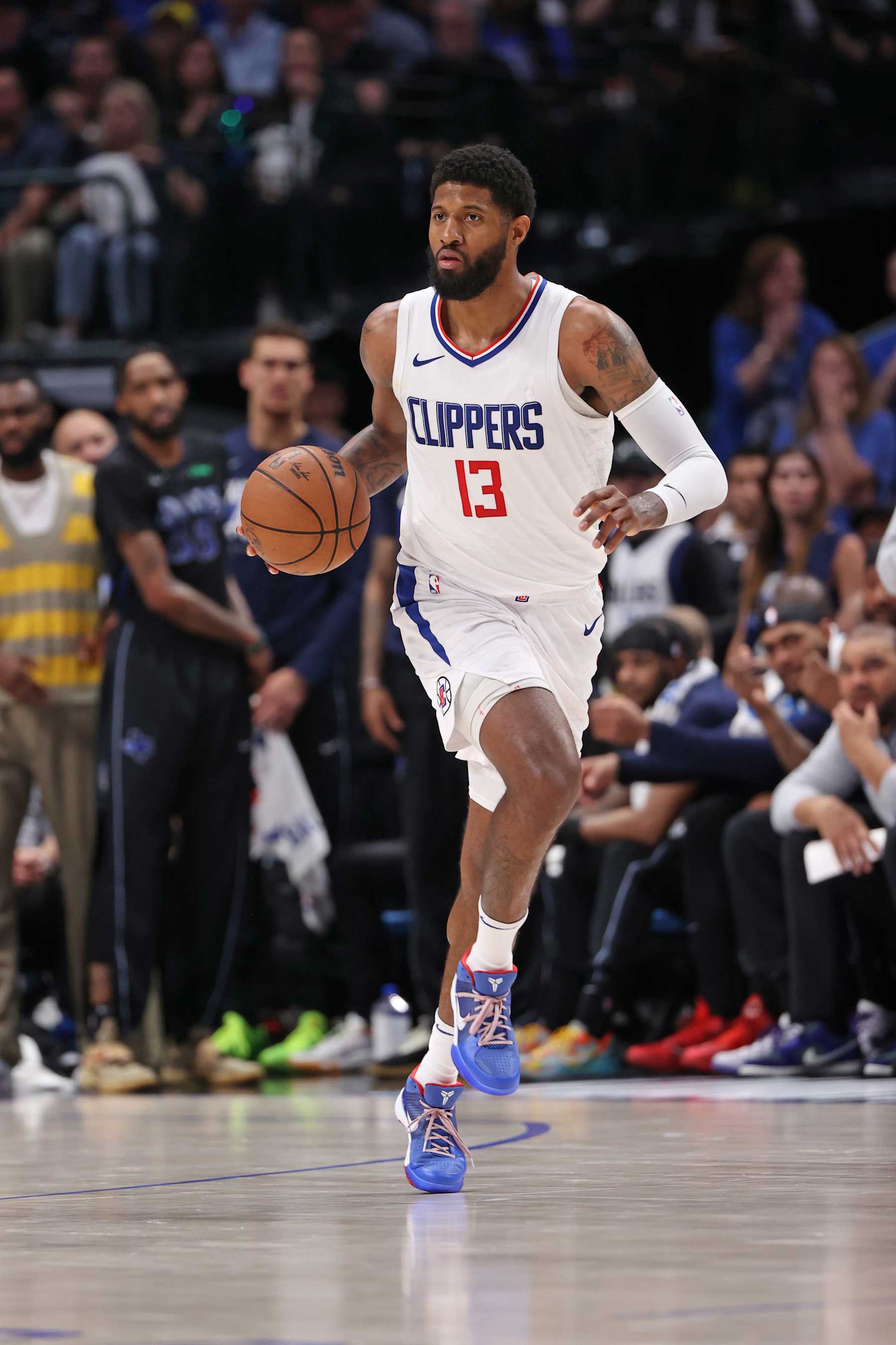 DALLAS, TX - MAY 3: Paul George #13 of the LA Clippers dribbles the ball during the game against the Dallas Mavericks during Round 1 Game 6 of the 2024 NBA Playoffs on May 3, 2024 at the American Airlines Center in Dallas, Texas. NOTE TO USER: User expressly acknowledges and agrees that, by downloading and or using this photograph, User is consenting to the terms and conditions of the Getty Images License Agreement. Mandatory Copyright Notice: Copyright 2024 NBAE (Photo by Joe Murphy/NBAE via Getty Images)