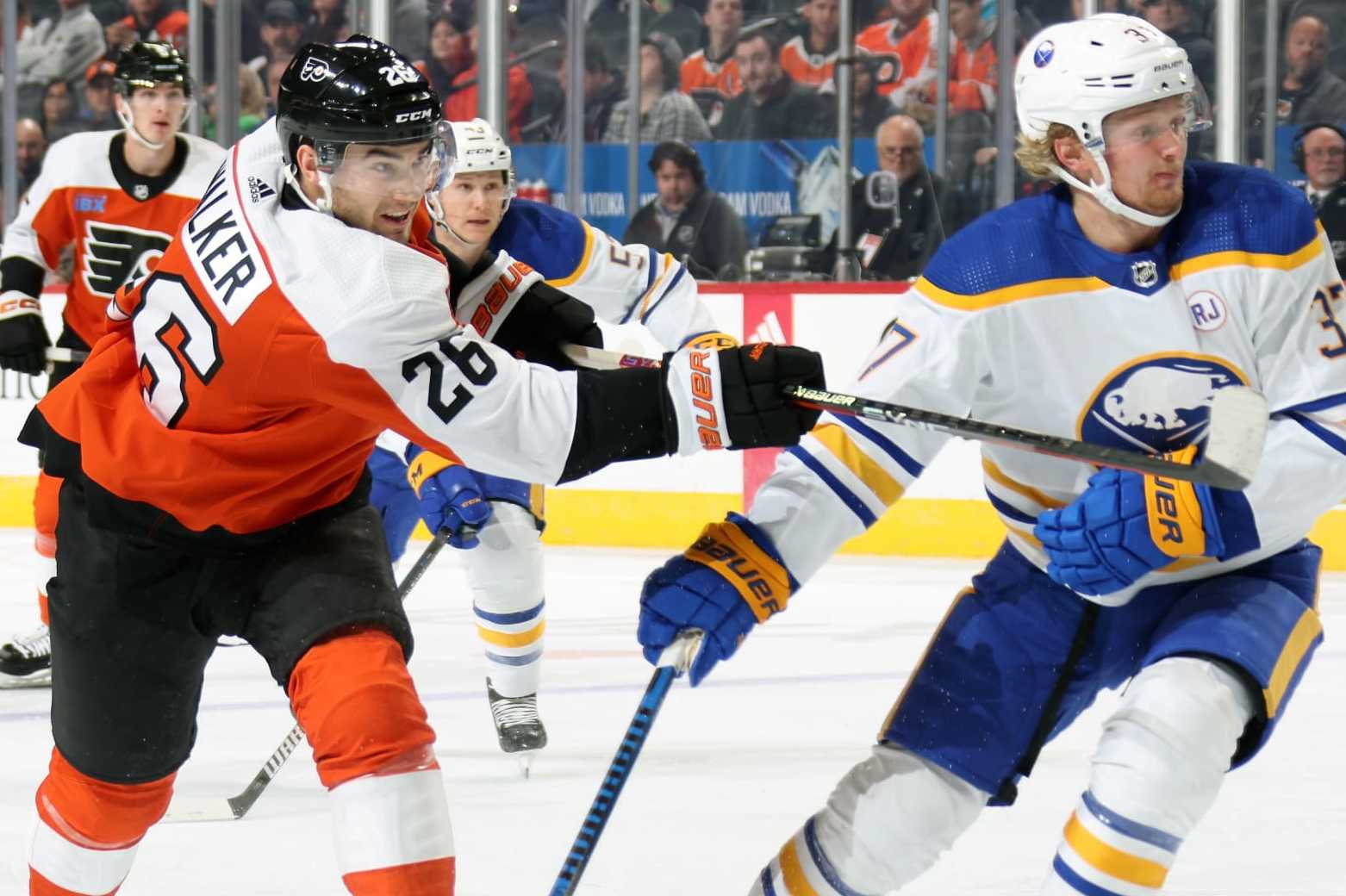 PHILADELPHIA, PENNSYLVANIA - NOVEMBER 01: Sean Walker #26 of the Philadelphia Flyers takes a slapshot against Casey Mittelstadt #37 of the Buffalo Sabres at the Wells Fargo Center on November 1, 2023 in Philadelphia, Pennsylvania. (Photo by Len Redkoles/NHLI via Getty Images)