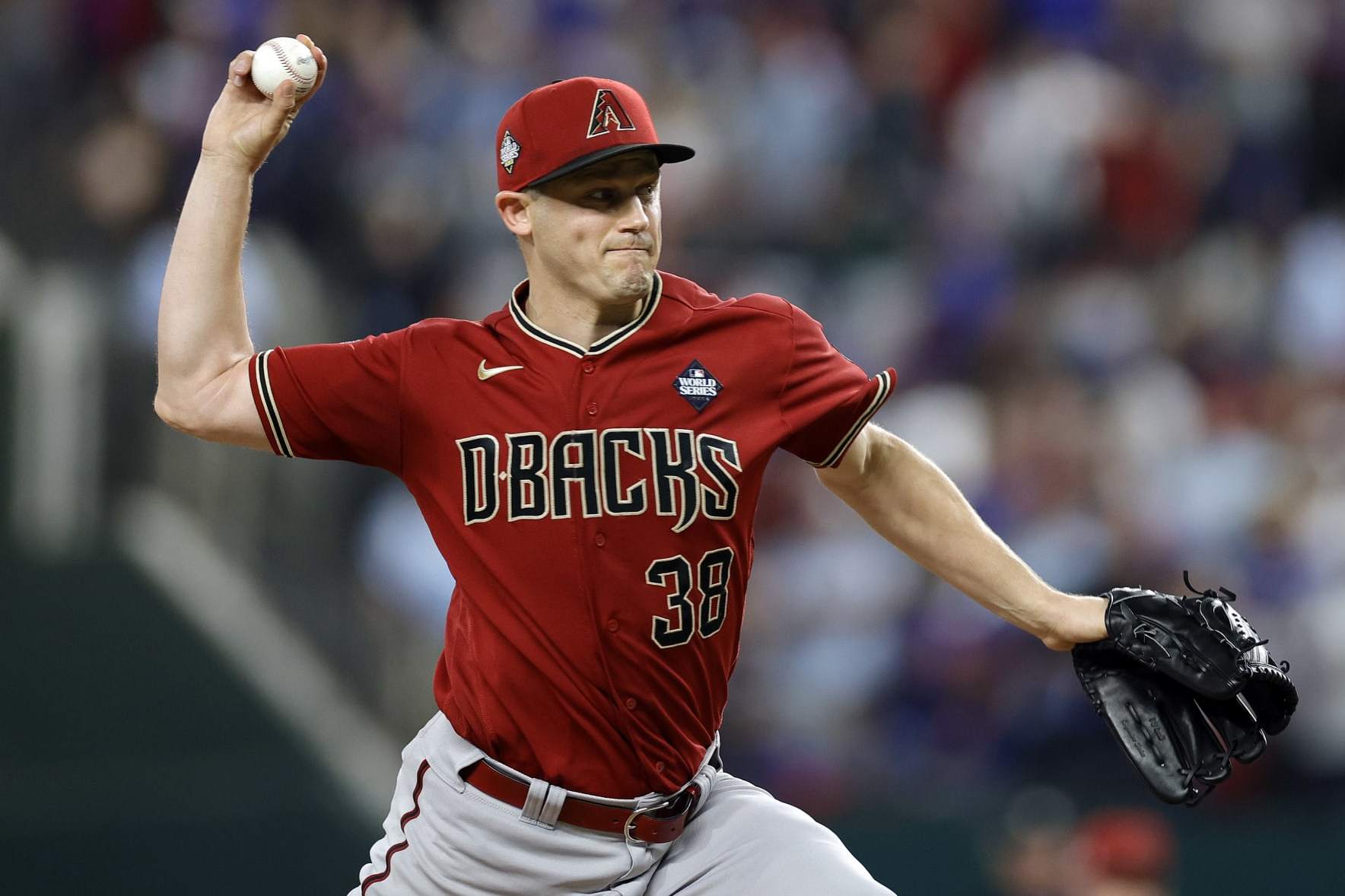 ARLINGTON, TEXAS - OCTOBER 27: Paul Sewald #38 of the Arizona Diamondbacks pitches in the ninth inning against the Texas Rangers during Game One of the World Series at Globe Life Field on October 27, 2023 in Arlington, Texas. (Photo by Carmen Mandato/Getty Images)