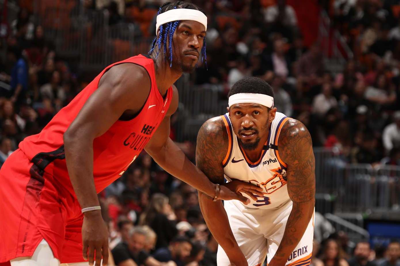 MIAMI, FL - DECEMBER 7: Bradley Beal #3 of the Phoenix Suns and Jimmy Butler #22 of the Miami Heat look on during the game between the against the Phoenix Suns against the Miami Heat on December 7, 2024 at Kaseya Center in Miami, Florida. NOTE TO USER: User expressly acknowledges and agrees that, by downloading and or using this Photograph, user is consenting to the terms and conditions of the Getty Images License Agreement. Mandatory Copyright Notice: Copyright 2024 NBAE (Photo by Issac Baldizon/NBAE via Getty Images)