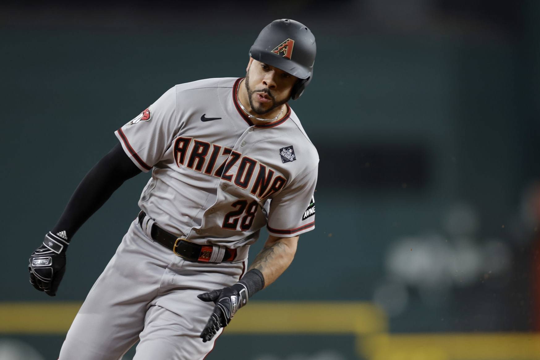 ARLINGTON, TEXAS - OCTOBER 28: Tommy Pham #28 of the Arizona Diamondbacks rounds third base in the fourth inning against the Texas Rangers during Game Two of the World Series at Globe Life Field on October 28, 2023 in Arlington, Texas. (Photo by Carmen Mandato/Getty Images)