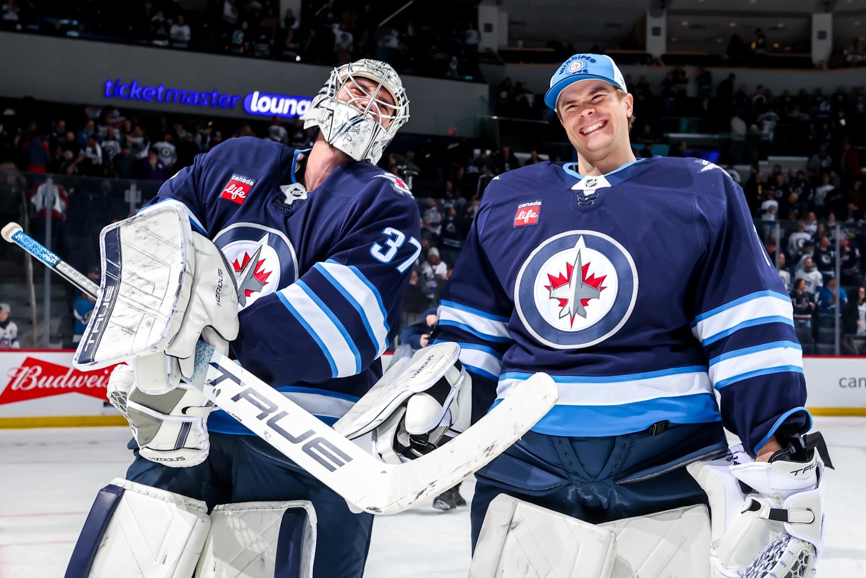 Connor Hellebuyck and Eric Comrie.