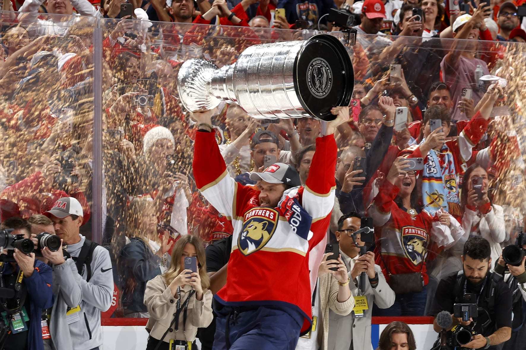 SUNRISE, FLORIDA - JUNE 24: Aleksander Barkov #16 of the Florida Panthers lifts the Stanley Cup after Florida's 2-1 victory against the Edmonton Oilers in Game Seven of the 2024 Stanley Cup Final at Amerant Bank Arena on June 24, 2024 in Sunrise, Florida. (Photo by Joel Auerbach/Getty Images)