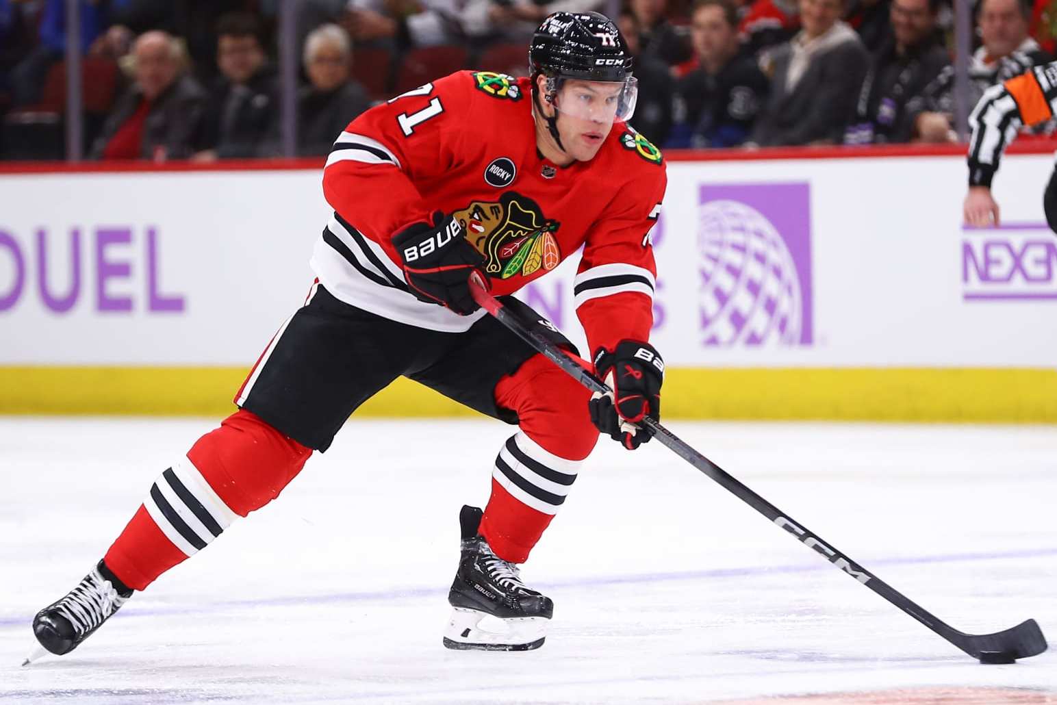 CHICAGO, IL - NOVEMBER 19: Taylor Hall #71 of the Chicago Blackhawks brings the puck up ice during the third period against the Buffalo Sabres at the United Center on November 19, 2023 in Chicago, Illinois. (Photo by Melissa Tamez/Icon Sportswire via Getty Images)