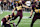 TEMPE, ARIZONA - OCTOBER 11: Kanyon Floyd #31 of the Arizona State Sun Devils holds the ball for teammate Ian Hershey #30 of the Arizona State Sun Devils who makes the extra point in the third quarter of the Utah Utes versus the Arizona State Sun Devils football game at Mountain America Stadium on October 11, 2024 in Tempe, Arizona. (Photo by Bruce Yeung/Getty Images)