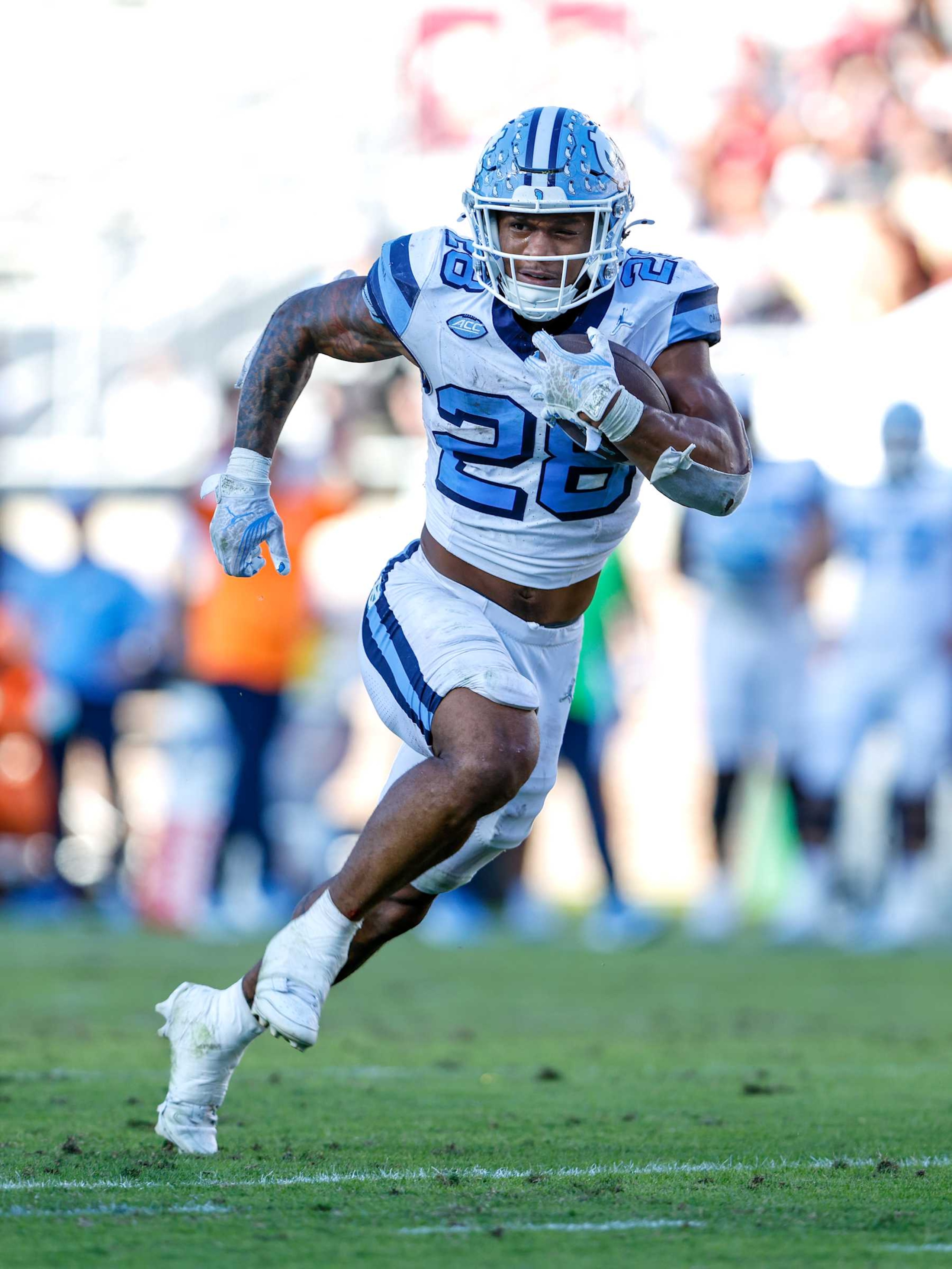 TALLAHASSEE, FL - NOVEMBER 2: Runningback Omarion Hampton #28 of the North Carolina Tar Heels on a running play for a touchdown during the second half of the game against the Florida State Seminoles at Doak Campbell Stadium on Bobby Bowden Field on November 2, 2024 in Tallahassee, Florida. The Tar Heels defeated the Seminoles 35 to 11. (Photo by Don Juan Moore/Getty Images)