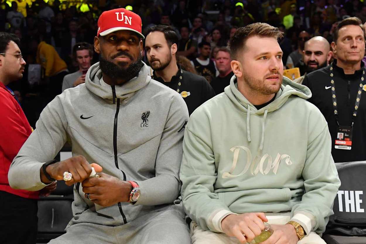 LOS ANGELES, CA - FEBRUARY 8: Luka Doncic #77 and LeBron James #23 of the Los Angeles Lakers look on before the game against the Indiana Pacers on February 8, 2025 at Crypto.Com Arena in Los Angeles, California. NOTE TO USER: User expressly acknowledges and agrees that, by downloading and/or using this Photograph, user is consenting to the terms and conditions of the Getty Images License Agreement. Mandatory Copyright Notice: Copyright 2025 NBAE (Photo by Juan Ocampo/NBAE via Getty Images)