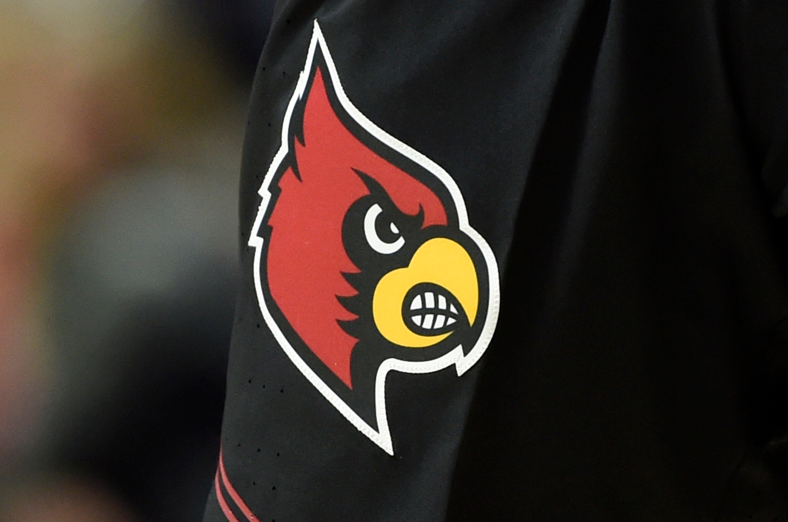 UNCASVILLE, CONNECTICUT - DECEMBER 19: The Louisville Cardinals logo on their uniform during the game against the Connecticut Huskies in the Basketball Hall of Fame Women's Showcase at Mohegan Sun Arena on December 19, 2021 in Uncasville, Connecticut. (Photo by G Fiume/Getty Images)