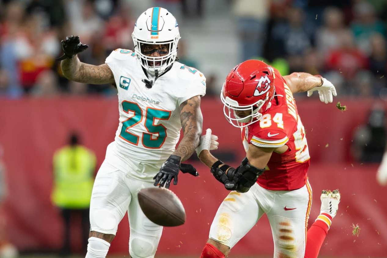 FRANKFURT AM MAIN, GERMANY - NOVEMBER 5: Xavien Howard of Miami Dolphins and Justin Watson of Kansas City Chiefs battle for the ball during the NFL match between Miami Dolphins and Kansas City Chiefs at Deutsche Bank Park on November 5, 2023 in Frankfurt am Main, Germany. (Photo by Mario Hommes/DeFodi Images via Getty Images)