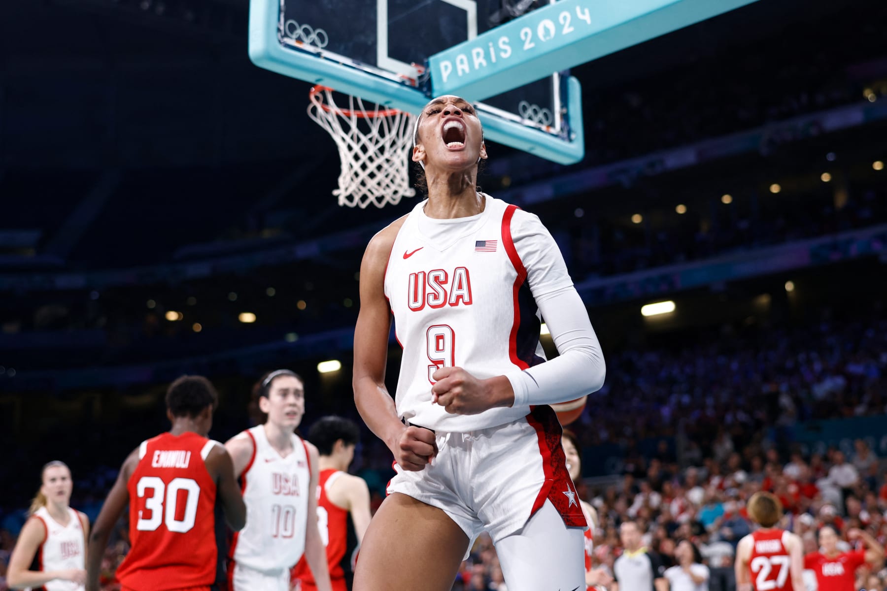 USA's #09 A'ja Wilson celebrates after scoring in the women's preliminary round group C basketball match between USA and Japan during the Paris 2024 Olympic Games at the Pierre-Mauroy stadium in Villeneuve-d'Ascq, northern France, on July 29, 2024. (Photo by Sameer Al-Doumy / AFP) (Photo by SAMEER AL-DOUMY/AFP via Getty Images)