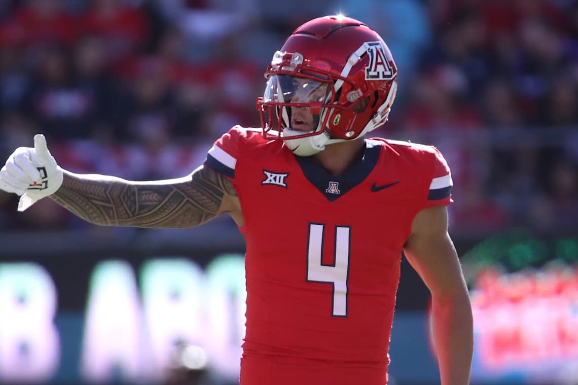 TUCSON, ARIZONA - NOVEMBER 30: Wide receiver Tetairoa McMillan #4 of the University of Arizona Wildcats checks with the referee to make sure that the offense is on the line during the first half of the University of Arizona Wildcats versus the Arizona State Sun Devils football game at Arizona Stadium on November 30, 2024 in Tucson, Arizona. (Photo by Bruce Yeung/Getty Images)