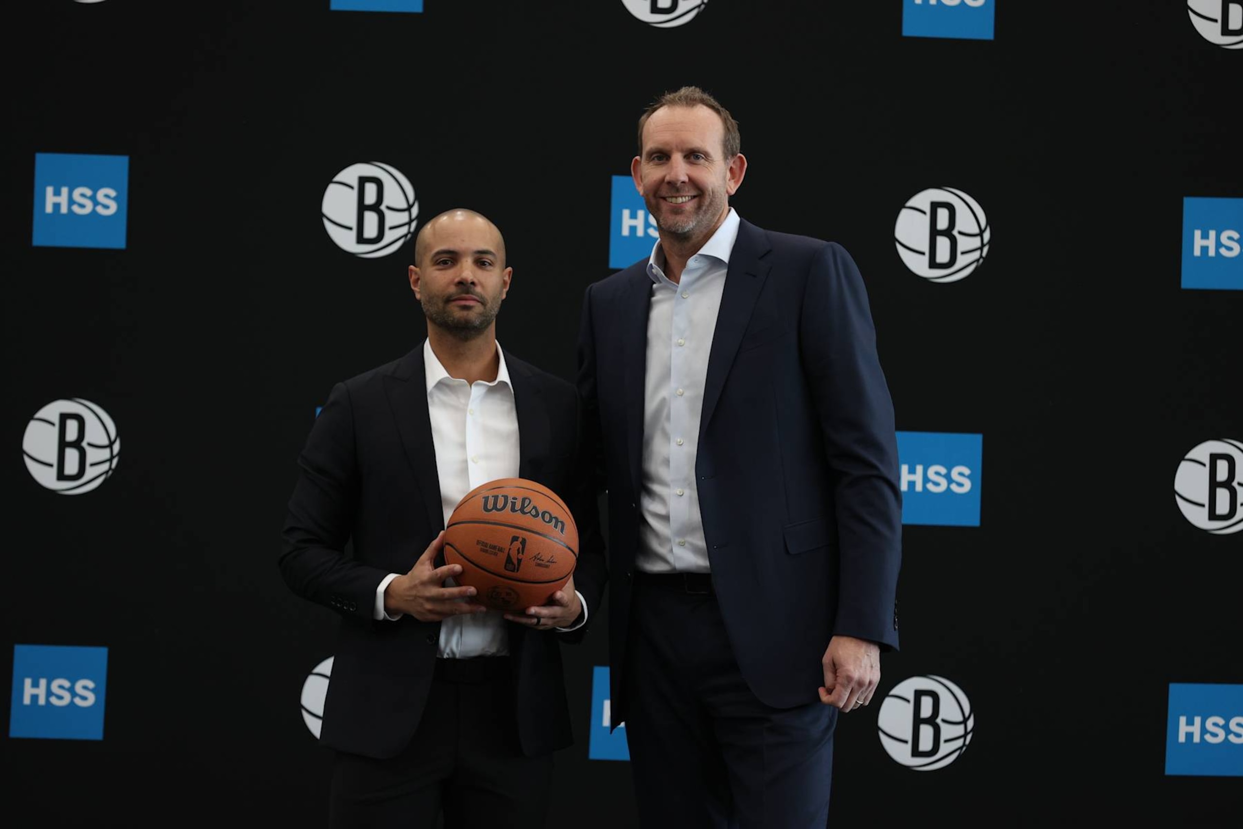BROOKLYN, NY - APRIL 24: Jordi Fernandez along with Alternate Governor Sean Marks of the Brooklyn Nets pose for a photo after being introduced as Brooklyn Nets new head coach during a press conference on April 24, 2024 at the Nets Training Center in Brooklyn, New York. NOTE TO USER: User expressly acknowledges and agrees that, by downloading and or using this Photograph, user is consenting to the terms and conditions of the Getty Images License Agreement. Mandatory Copyright Notice: Copyright 2024 NBAE (Photo by Nathaniel S. Butler/NBAE via Getty Images)
