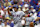 CHICAGO - JUNE 19: Catcher Ivan Rodriguez #7 of the Texas Rangers eyes his batted ball as he follows through against the Chicago Cubs during the MLB game at Wrigley Field in Chicago, Illinois on June 19, 2002. The Rangers defeated the Cubs 7-4. (Photo by Jonathan Daniel/Getty Images)