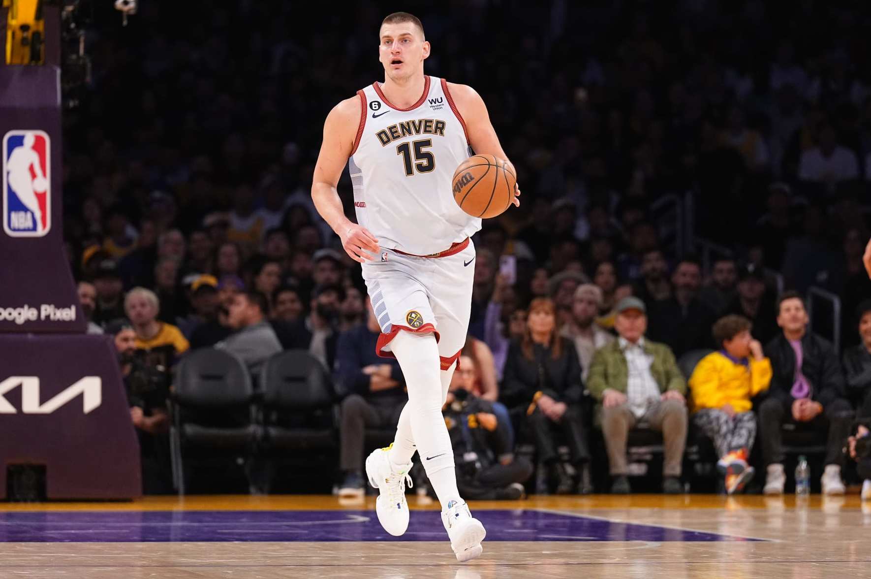 LOS ANGELES, CA - MAY 22: Nikola Jokic #15 of the Denver Nuggets dribbles the ball during Game Four of the Western Conference Finals against the Los Angeles Lakers on May 22, 2023 at Crypto.com Arena in Los Angeles, California. NOTE TO USER: User expressly acknowledges and agrees that, by downloading and/or using this Photograph, user is consenting to the terms and conditions of the Getty Images License Agreement. Mandatory Copyright Notice: Copyright 2023 NBAE (Photo by Garrett Ellwood/NBAE via Getty Images) LOS ANGELES, CA - MAY 22: Nikola Jokic #15 of the Denver Nuggets dribbles the ball during Game Four of the Western Conference Finals against the Los Angeles Lakers on May 22, 2023 at Crypto.com Arena in Los Angeles, California. NOTE TO USER: User expressly acknowledges and agrees that, by downloading and/or using this Photograph, user is consenting to the terms and conditions of the Getty Images License Agreement. Mandatory Copyright Notice: Copyright 2023 NBAE (Photo by Garrett Ellwood/NBAE via Getty Images)