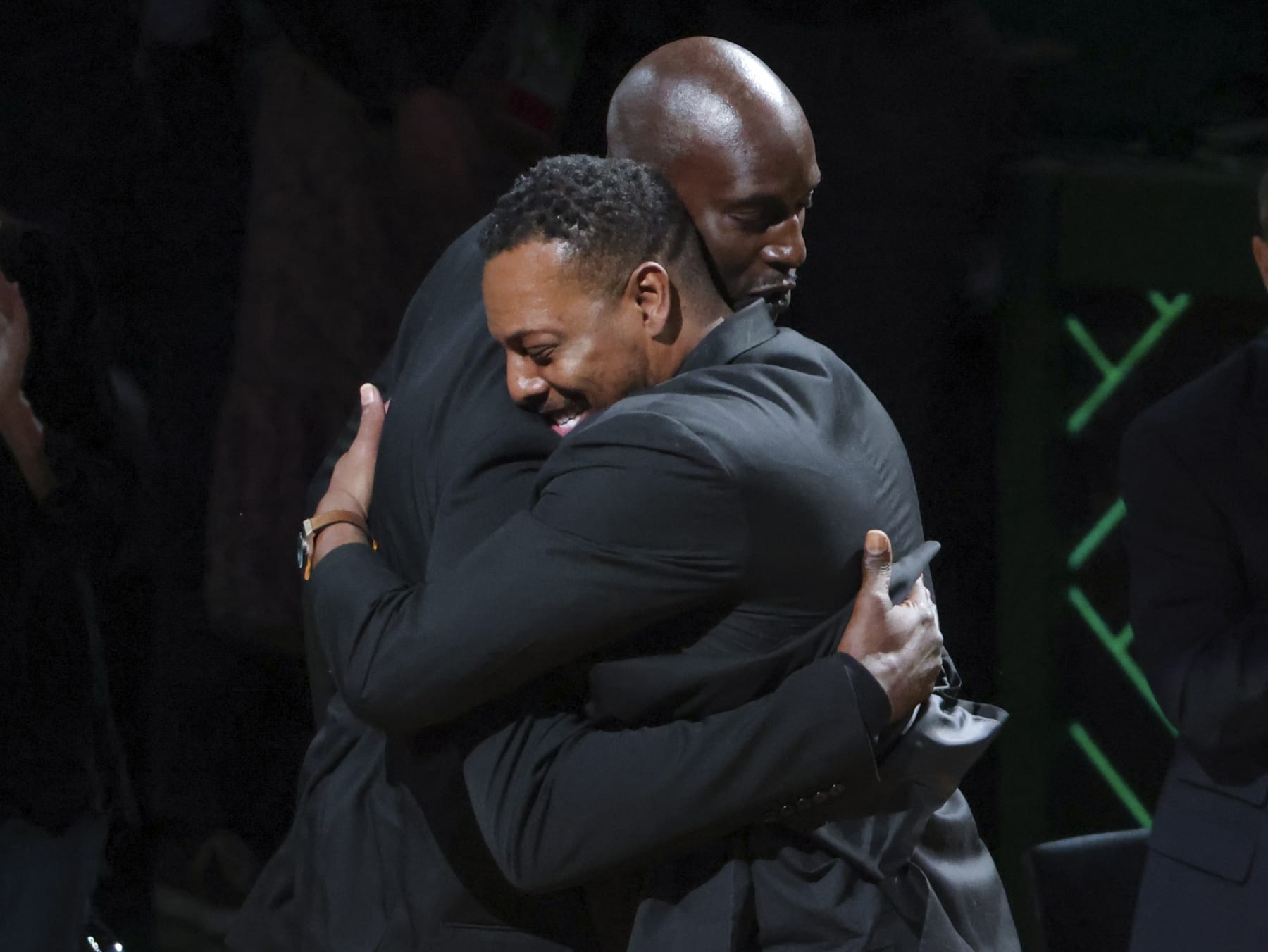 Boston - March 13: Former Boston Celtics player Kevin Garnett hugs former teammate Paul Pierce during Garnetts number retirement ceremony. The Boston Celtics host the Dallas Mavericks in an NBA game at TD Garden in Boston on March 13, 2022. (Photo by Matthew J. Lee/The Boston Globe via Getty Images)