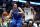 DALLAS, TEXAS - DECEMBER 14: Luka Doncic #77 of the Dallas Mavericks drives to the basket against Anthony Edwards #5 of the Minnesota Timberwolves in the second half at American Airlines Center on December 14, 2023 in Dallas, Texas. NOTE TO USER: User expressly acknowledges and agrees that, by downloading and or using this photograph, User is consenting to the terms and conditions of the Getty Images License Agreement. (Photo by Tim Heitman/Getty Images)