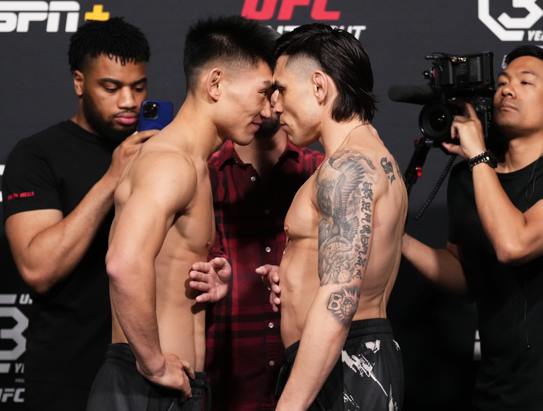 LAS VEGAS, NEVADA - APRIL 28: (L-R) Opponents Song Yadong of China and Ricky Simon face off during the UFC Fight Night weigh-in at UFC APEX on April 28, 2023 in Las Vegas, Nevada. (Photo by Jeff Bottari/Zuffa LLC via Getty Images)