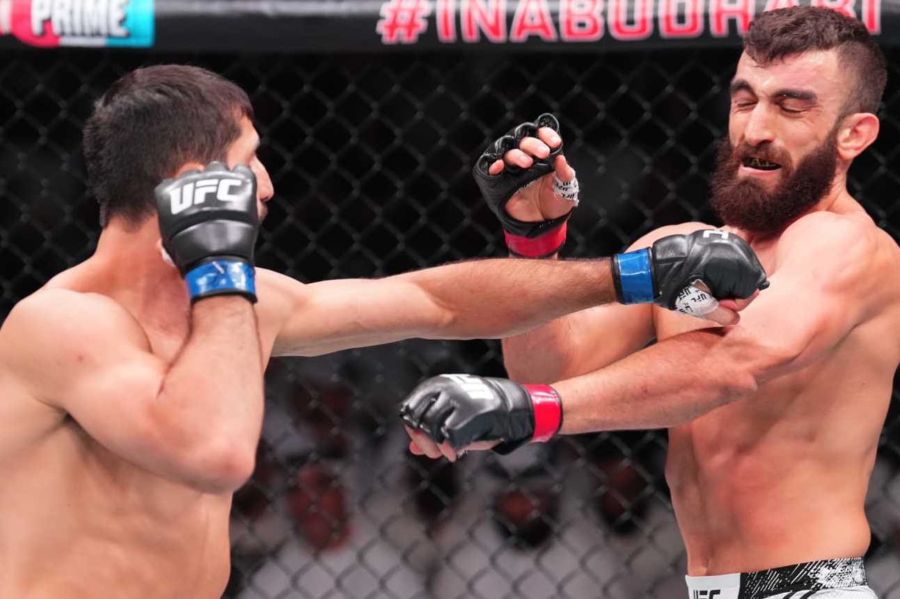 ABU DHABI, UNITED ARAB EMIRATES - AUGUST 03: (L-R) Kaue Fernandes of Brazil punches Mohammad Yahya of the United Arab Emirates in a lightweight fight during the UFC Fight Night event at Etihad Arena on August 03, 2024 in Abu Dhabi, United Arab Emirates. (Photo by Josh Hedges/Zuffa LLC via Getty Images)
